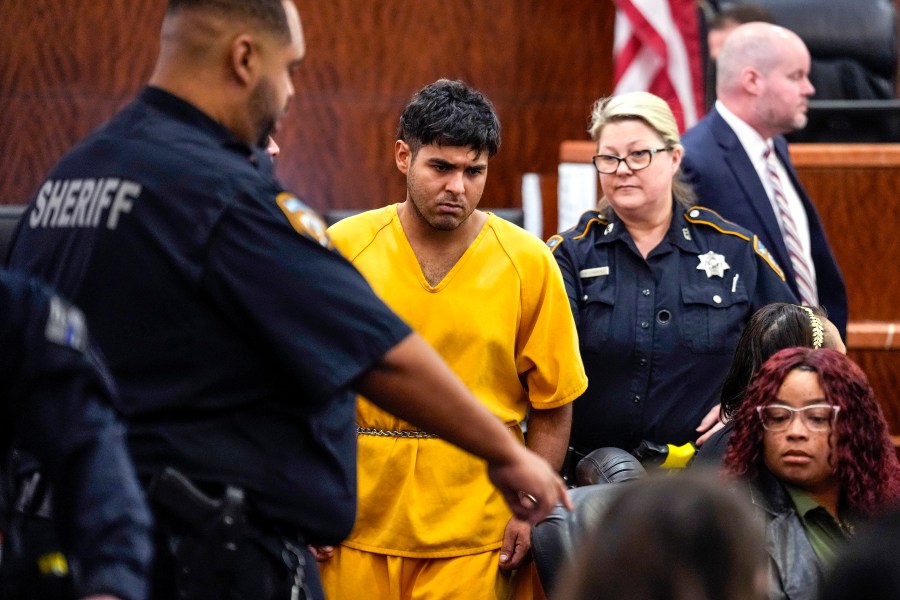 FILE - Johan Jose Martinez-Rangel, one of the two men accused of killing 12-year-old Jocelyn Nungaray, is led from the courtroom by deputies on Tuesday, June 25, 2024 in Houston. (Brett Coomer/Houston Chronicle via AP, File)