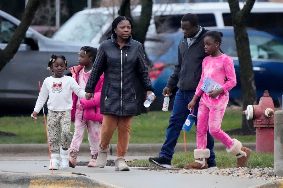 A family leaves the SSMI Health Center, set up as an reunification center, in Madison, Wis., following a shooting, Monday, Dec. 16, 2024. (AP Photo/Morry Gash)