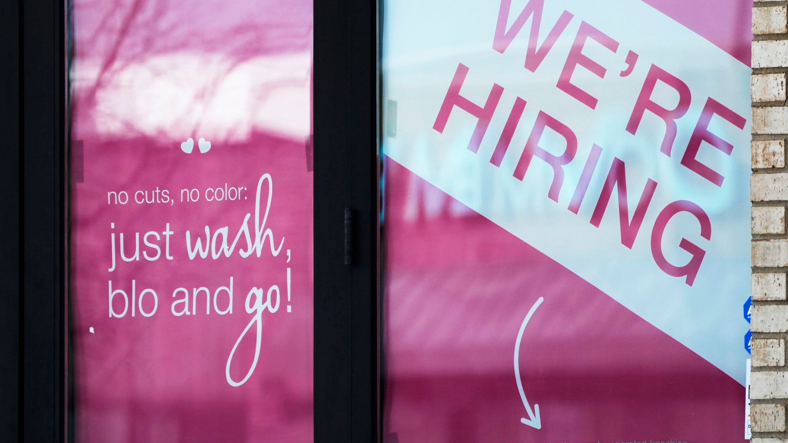 FILE - A hiring sign is displayed at a hair salon in Vernon Hills, Ill., March 28, 2023. (AP Photo/Nam Y. Huh, File)