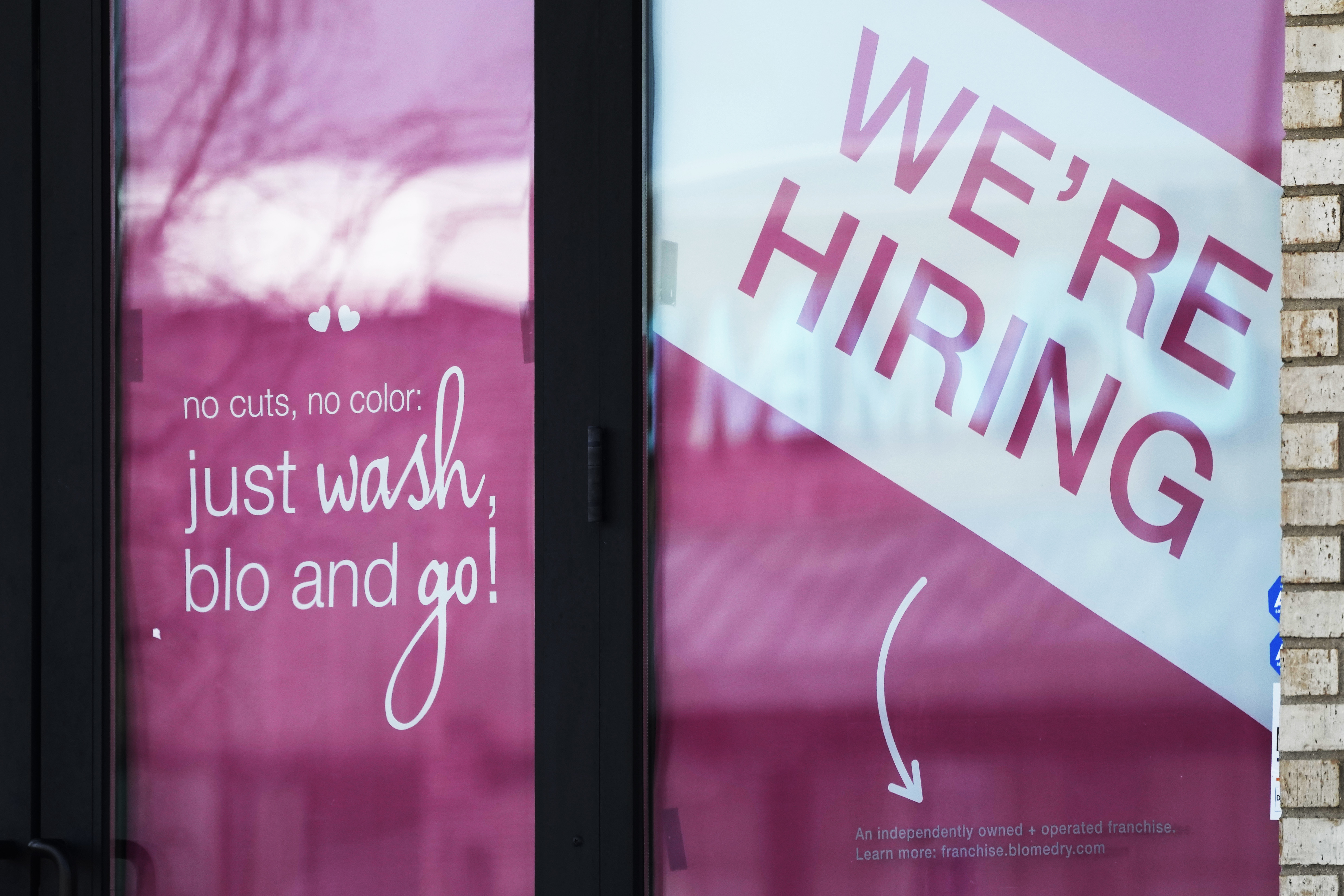 FILE - A hiring sign is displayed at a hair salon in Vernon Hills, Ill., March 28, 2023. (AP Photo/Nam Y. Huh, File)