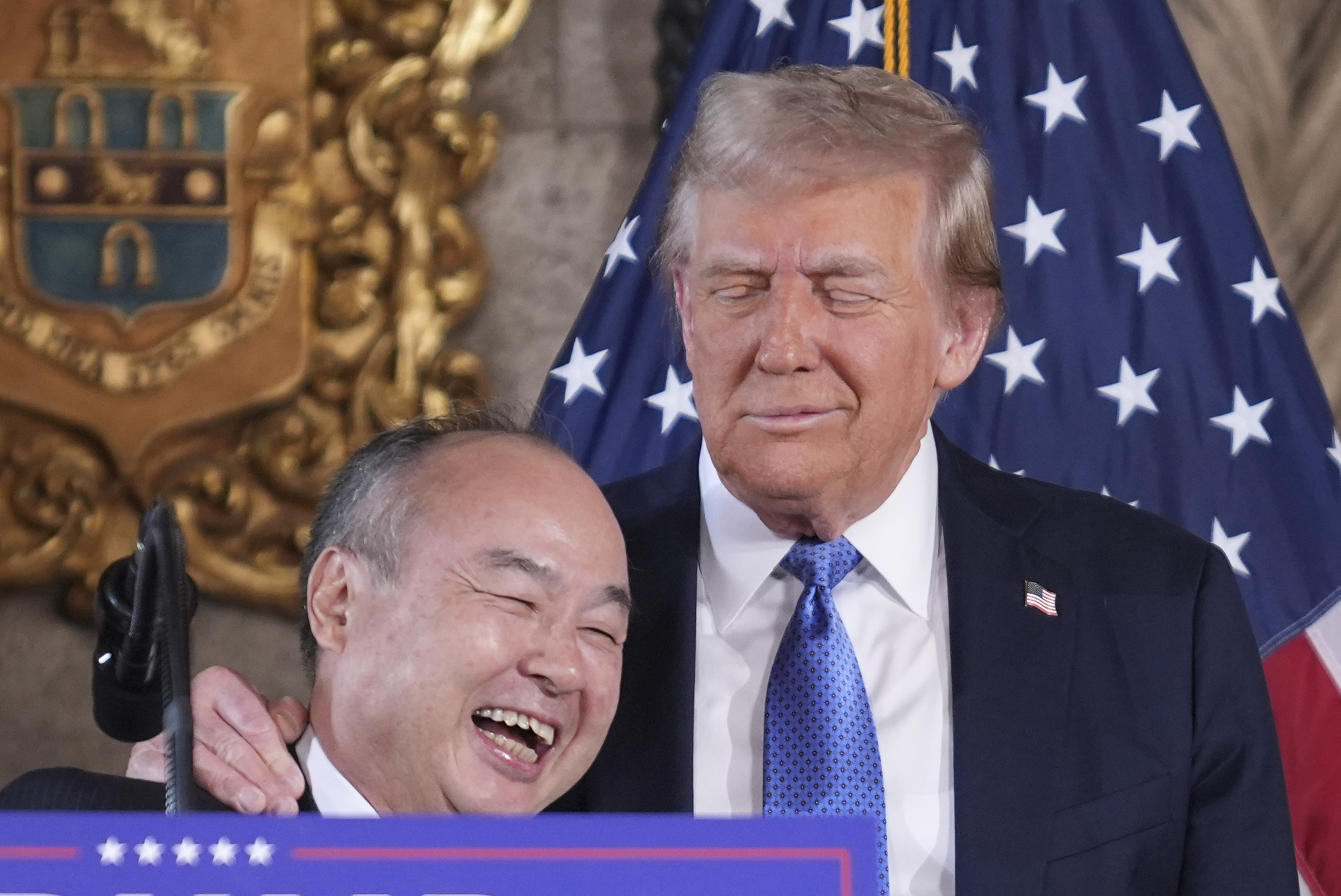 SoftBank Group CEO Masayoshi Son smiles with President-elect Donald Trump during a news conference at Mar-a-Lago, Monday, Dec. 16, 2024, in Palm Beach, Fla. (AP Photo/Evan Vucci)