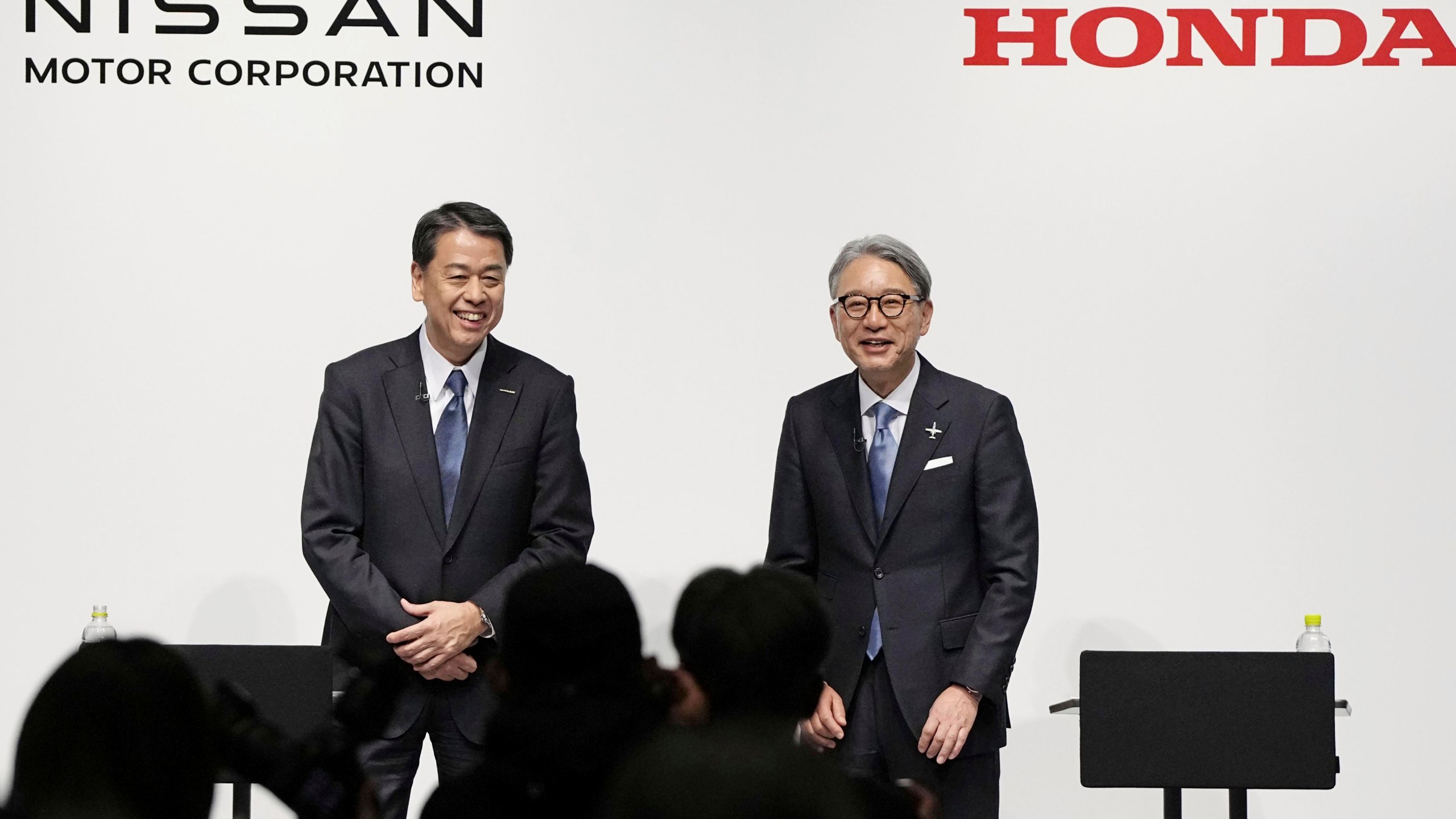 FILE - Nissan Chief Executive Makoto Uchida, left, and Honda President Toshihiro Mibe attend a joint news conference in Tokyo, Friday, March 15, 2024. (Kyodo News via AP, File)