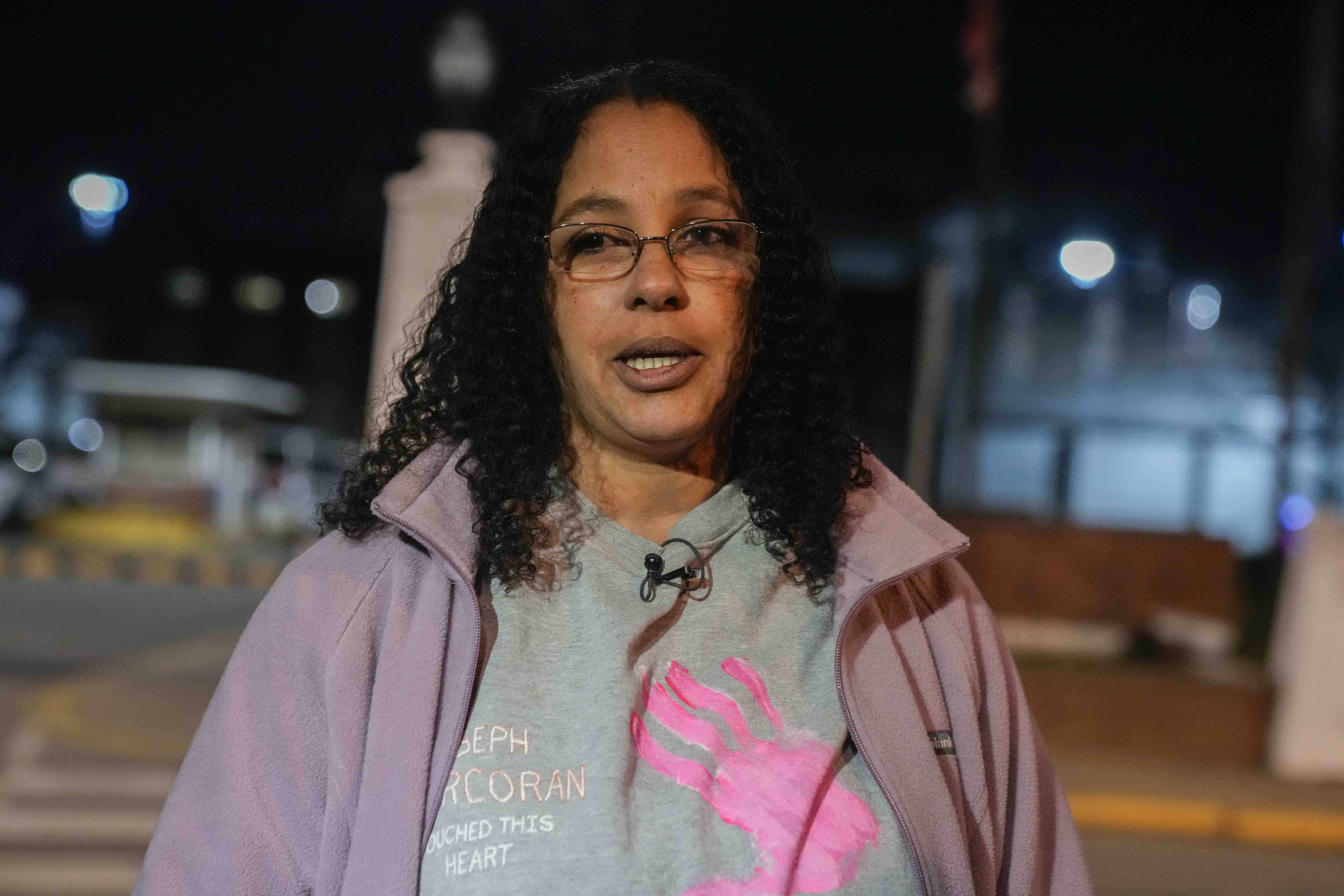 Calling herself his wife, Tahina Corcoran speaks outside of Indiana State Prison on Tuesday, Dec. 17, 2024, in Michigan City, Ind., where, barring last-minute court action or intervention by Gov. Eric Holcomb, Joseph Corcoran, 49, convicted in the 1997 killings of his brother and three other people, is scheduled to be put to death by lethal injection before sunrise Wednesday, Dec. 18. (AP Photo/Erin Hooley)