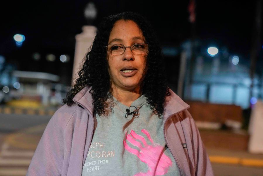 Calling herself his wife, Tahina Corcoran speaks outside of Indiana State Prison on Tuesday, Dec. 17, 2024, in Michigan City, Ind., where, barring last-minute court action or intervention by Gov. Eric Holcomb, Joseph Corcoran, 49, convicted in the 1997 killings of his brother and three other people, is scheduled to be put to death by lethal injection before sunrise Wednesday, Dec. 18. (AP Photo/Erin Hooley)