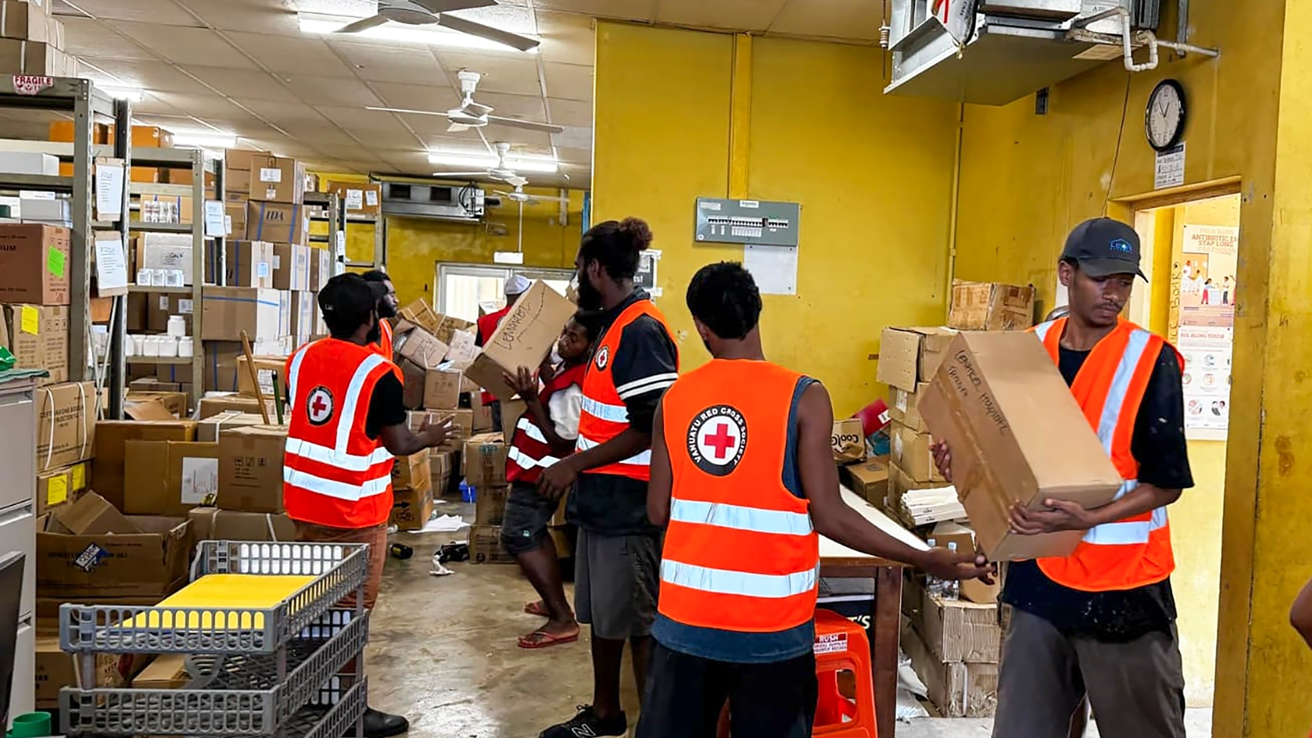 In this image released by Vanuatu Red Cross Society, its volunteers assist staff with the clean up at Vila Central Hospital in Port Vila, Vanuatu Wednesday, Dec. 18, 2024, following a powerful earthquake that struck just off the coast of Vanuatu in the South Pacific Ocean. (Vanuatu Red Cross Society via AP)