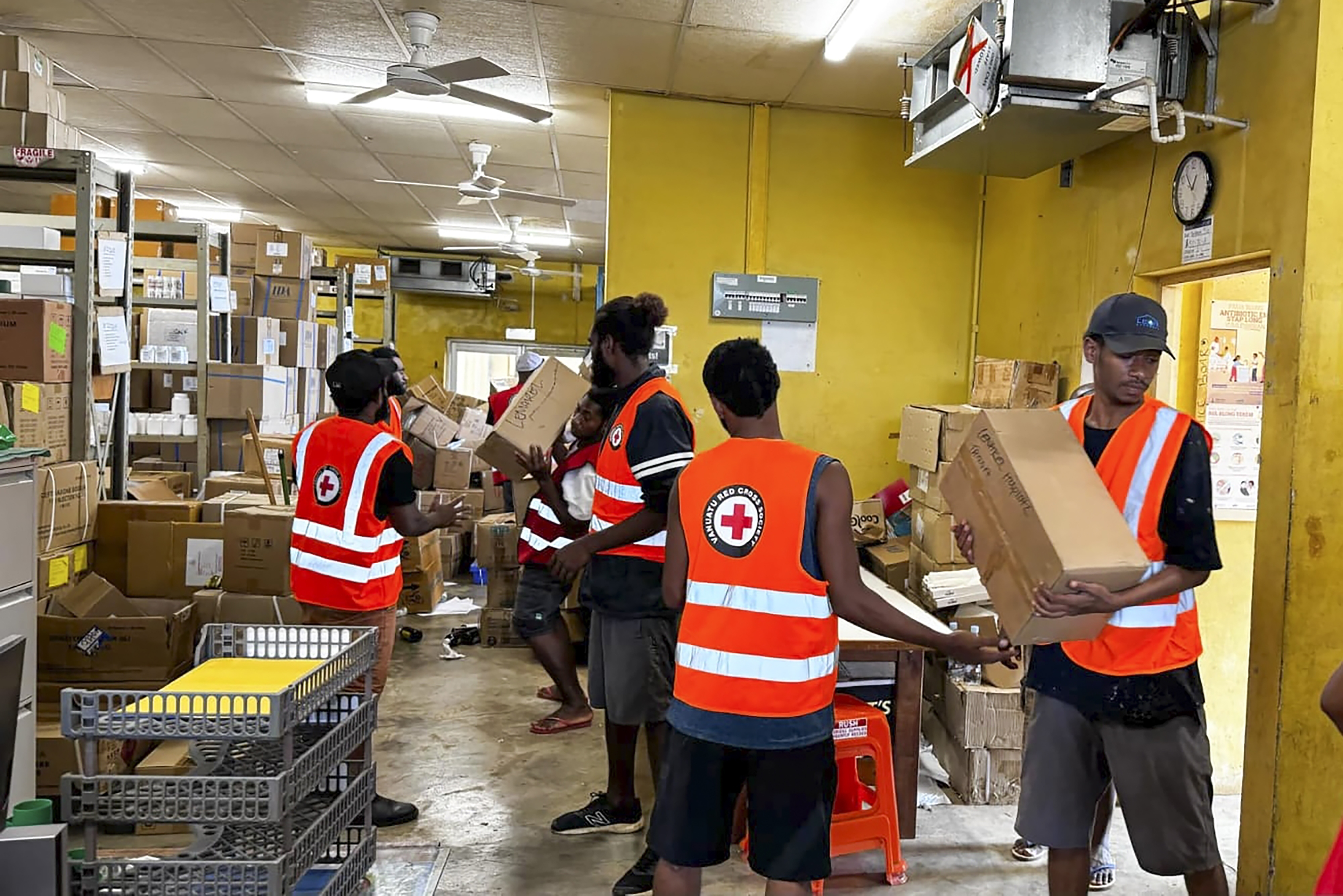 In this image released by Vanuatu Red Cross Society, its volunteers assist staff with the clean up at Vila Central Hospital in Port Vila, Vanuatu Wednesday, Dec. 18, 2024, following a powerful earthquake that struck just off the coast of Vanuatu in the South Pacific Ocean. (Vanuatu Red Cross Society via AP)