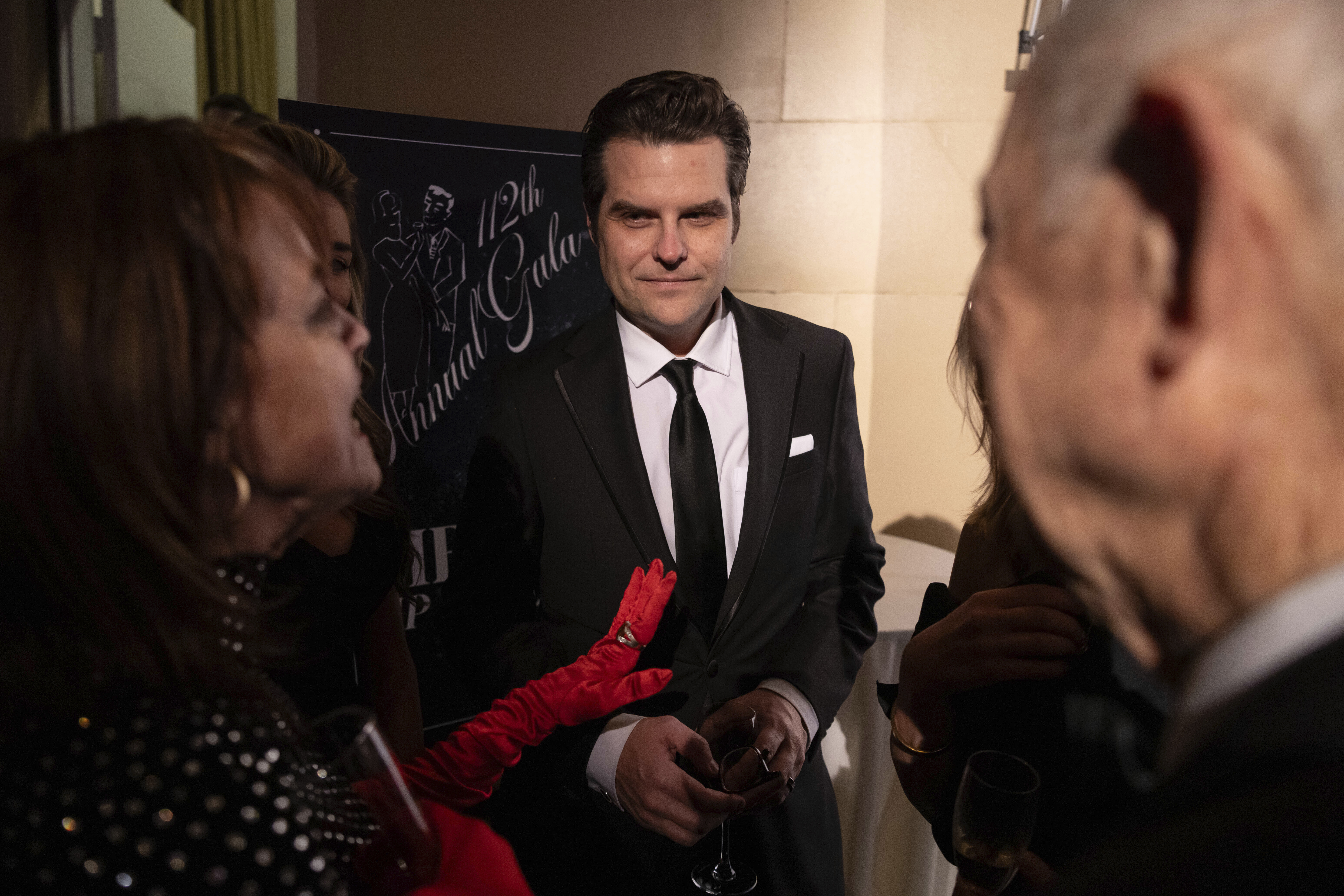 Former Rep. Matt Gaetz, R-Fla., center, attends the cocktail hour of New York Young Republican Club's annual gala at Cipriani Wall Street, Sunday, Dec. 15, 2024, in New York. (AP Photo/Yuki Iwamura)