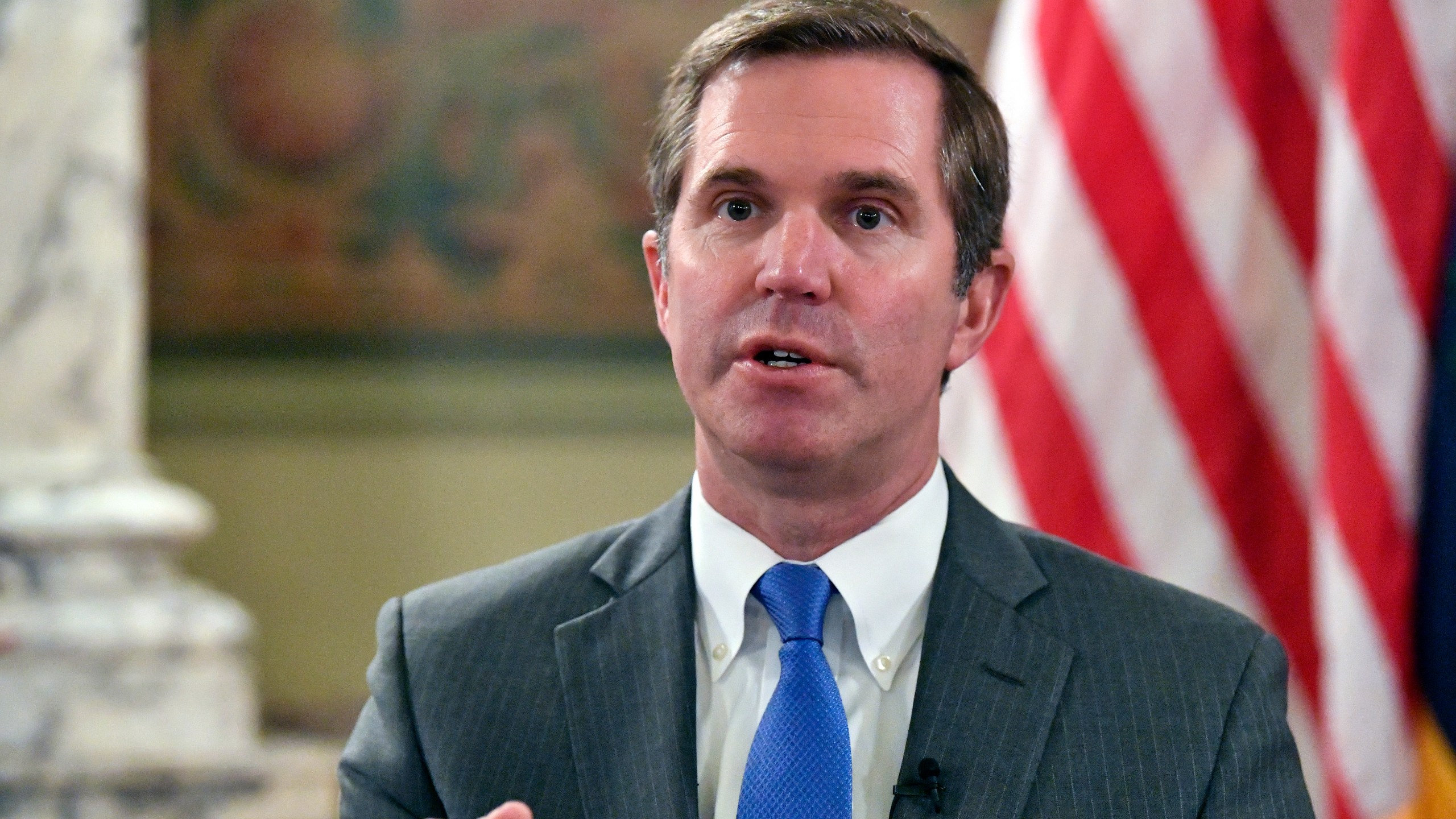 Kentucky Gov. Andy Beshear talks about the gains in the economic growth f the state during the past year in Frankfort, Ky., Wednesday, Dec. 18, 2024. (AP Photo/Timothy D. Easley)