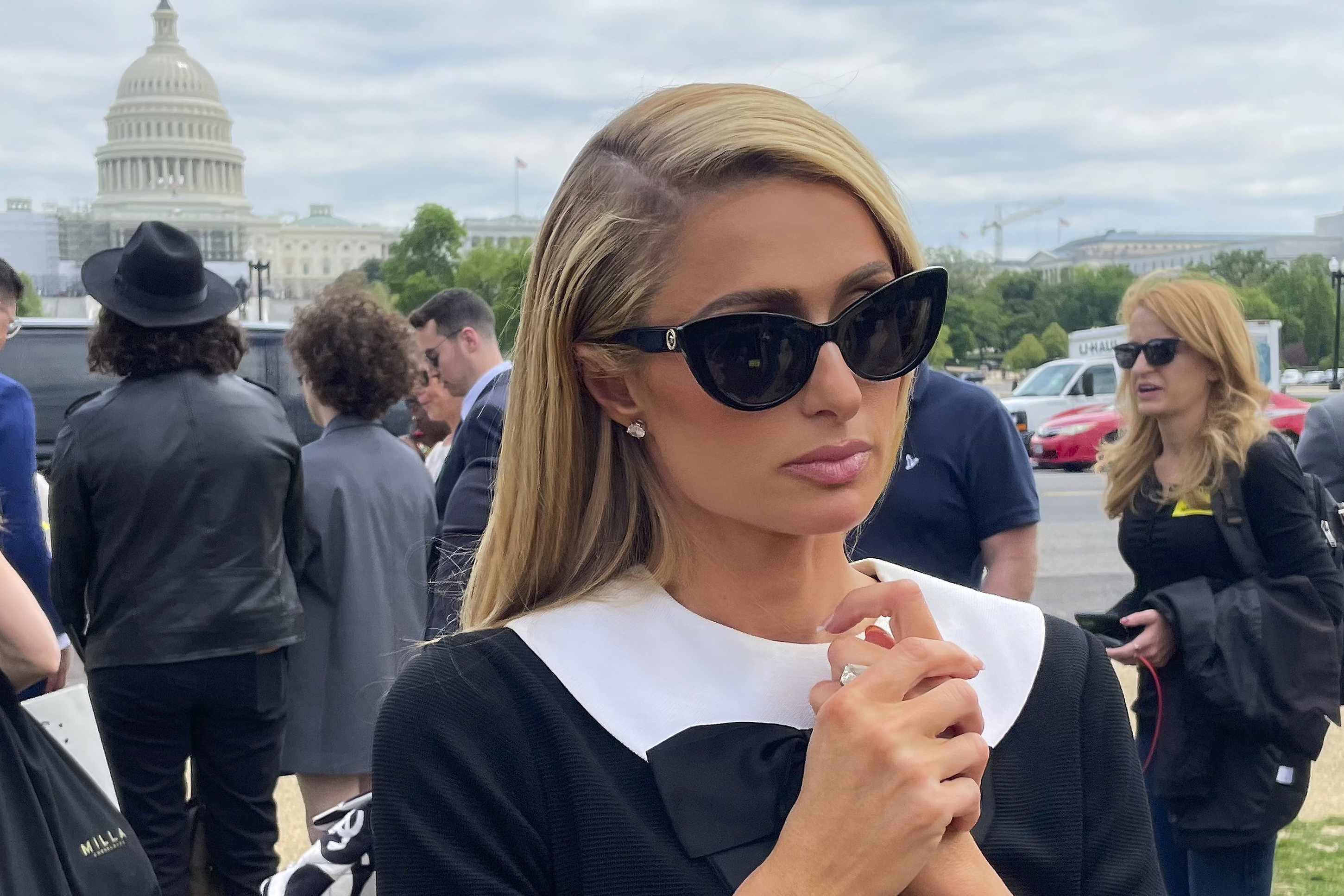 FILE - Paris Hilton meets with a supporters after speaking at a Stop Institutional Child Abuse, May 11, 2022 in Washington. The House has passed legislation requiring more oversight of youth residential treatment facilities. The vote Wednesday is a feat for hotel heiress Paris Hilton who has spent years lobbying lawmakers to regulate the industry. (AP Photo/Pablo Martinez Monsivais, File)