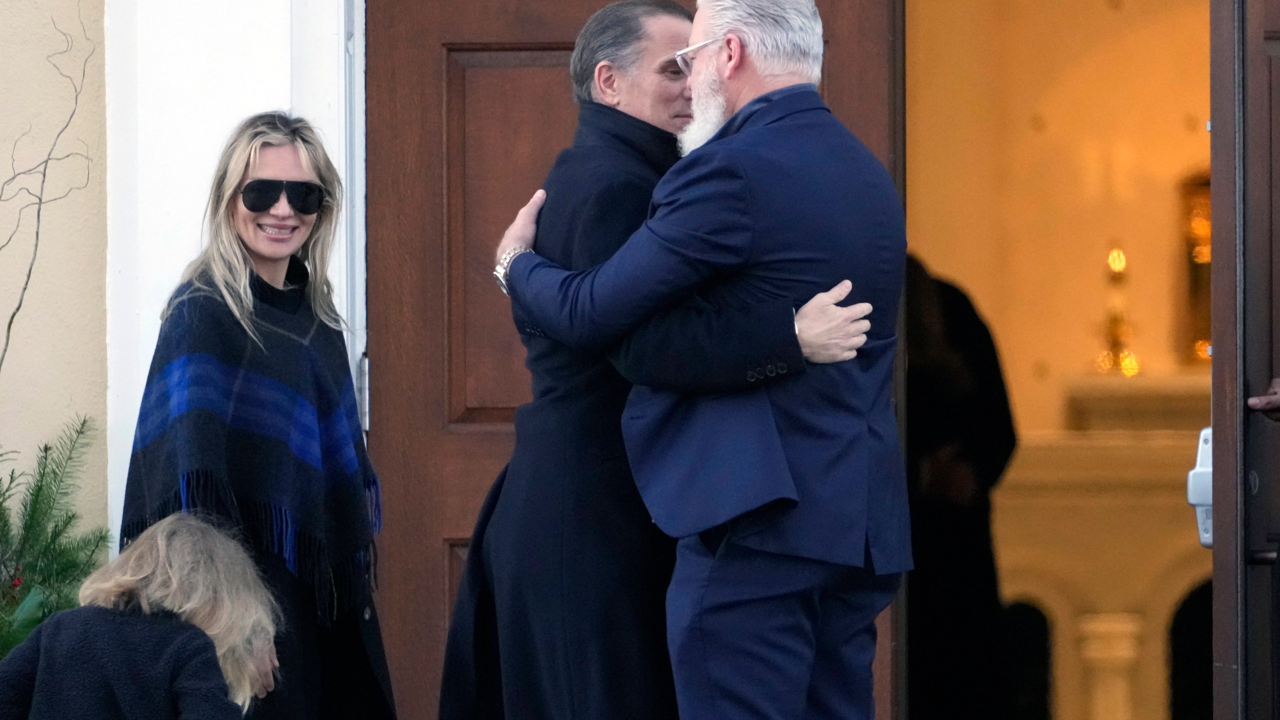 Hunter Biden, his wife Melissa Cohen Biden and their son Beau are greeted as they arrive at St. Joseph on the Brandywine Catholic Church in Wilmington, Del., on Wednesday, Dec. 18, 2024. Wednesday marks the 52nd anniversary of the car crash that killed President Joe Biden's first wife Neilia Hunter Biden and 13-month-old daughter Naomi. (AP Photo/Ben Curtis)