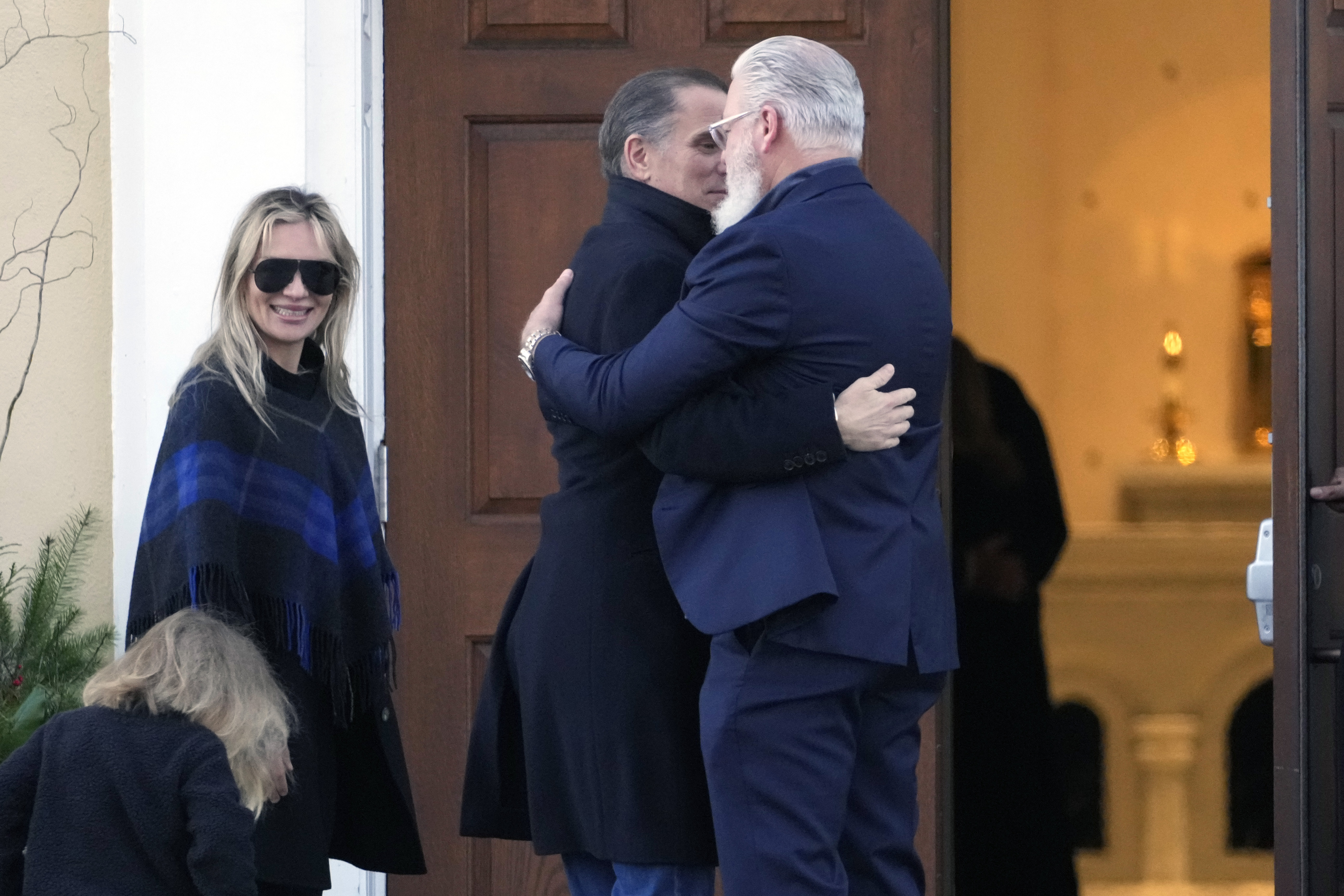 Hunter Biden, his wife Melissa Cohen Biden and their son Beau are greeted as they arrive at St. Joseph on the Brandywine Catholic Church in Wilmington, Del., on Wednesday, Dec. 18, 2024. Wednesday marks the 52nd anniversary of the car crash that killed President Joe Biden's first wife Neilia Hunter Biden and 13-month-old daughter Naomi. (AP Photo/Ben Curtis)