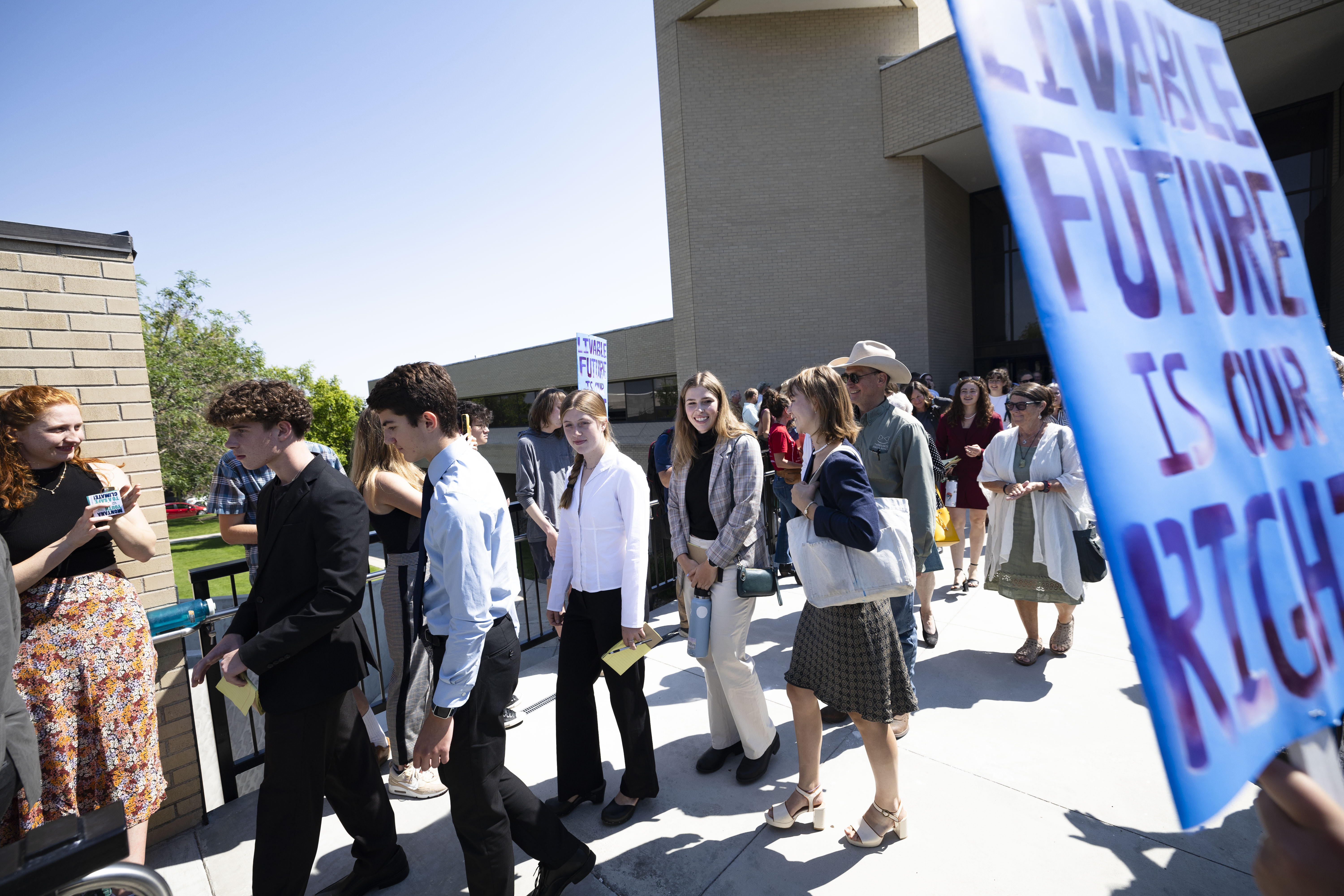 FILE - Youth plaintiffs in the Held v. Montana climate case leave the Montana Supreme Court, on July 10, 2024, in Helena, Mont. (Thom Bridge/Independent Record via AP, File)