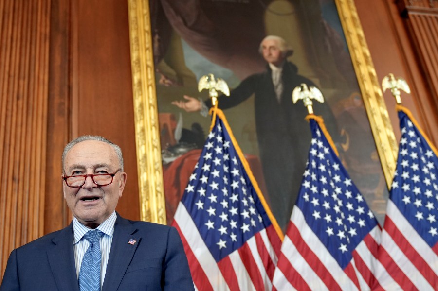 Senate Majority Leader Chuck Schumer, D-N.Y., prays during a U.S. Capitol Hanukkah event with a ceremonial Menorah lighting to commemorate the upcoming eight-day festival of Hanukkah on Capitol Hill Tuesday, Dec. 17, 2024, in Washington. (AP Photo/Mariam Zuhaib)