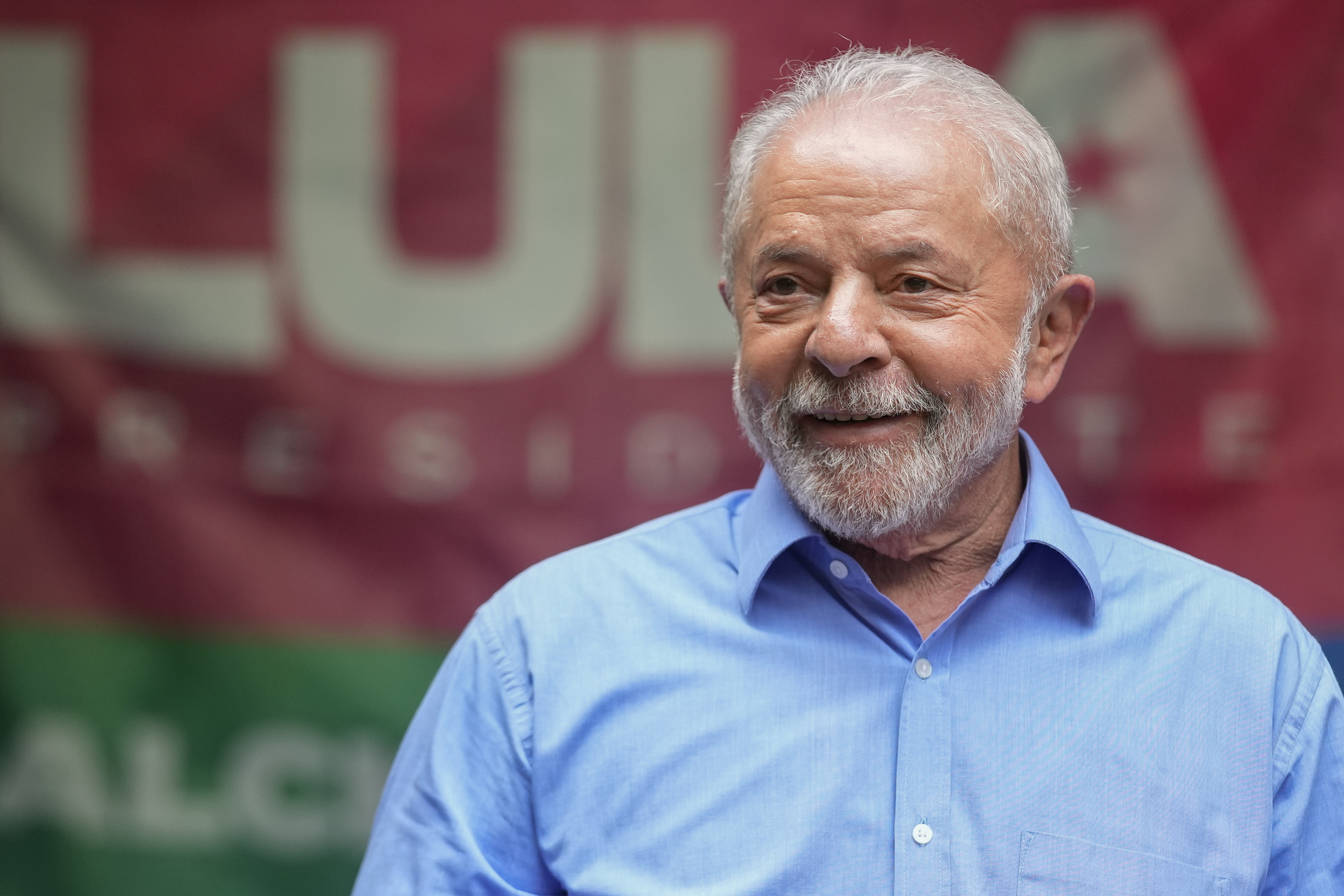 FILE - Brazil's former President Luiz Inacio Lula da Silva, who is running for reelection, smiles during a press conference in Sao Paulo, Brazil, Oct. 23, 2022. (AP Photo/Andre Penner, File)