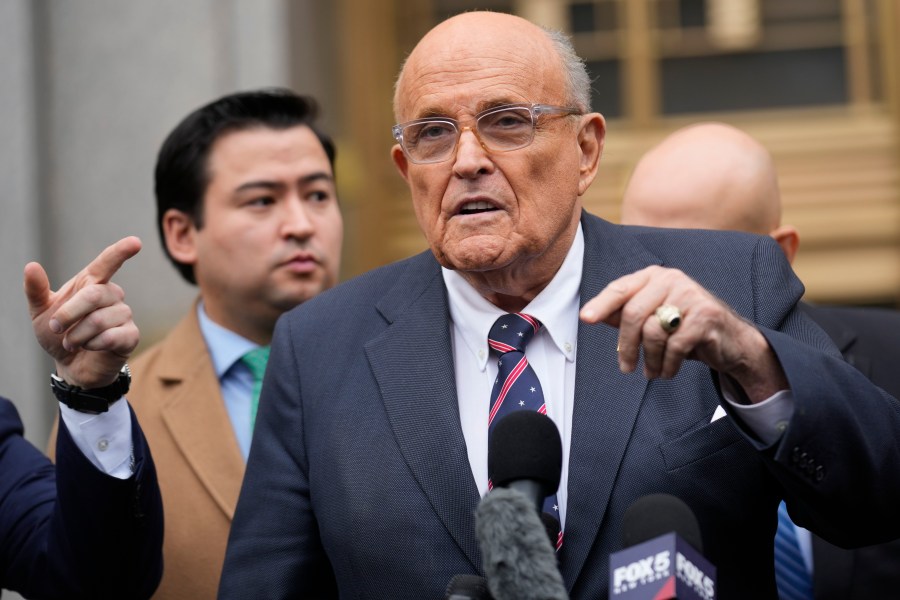 FILE - Rudy Giuliani speaks to reporters as he leaves the federal courthouse in New York, Nov. 26, 2024. (AP Photo/Seth Wenig, File)