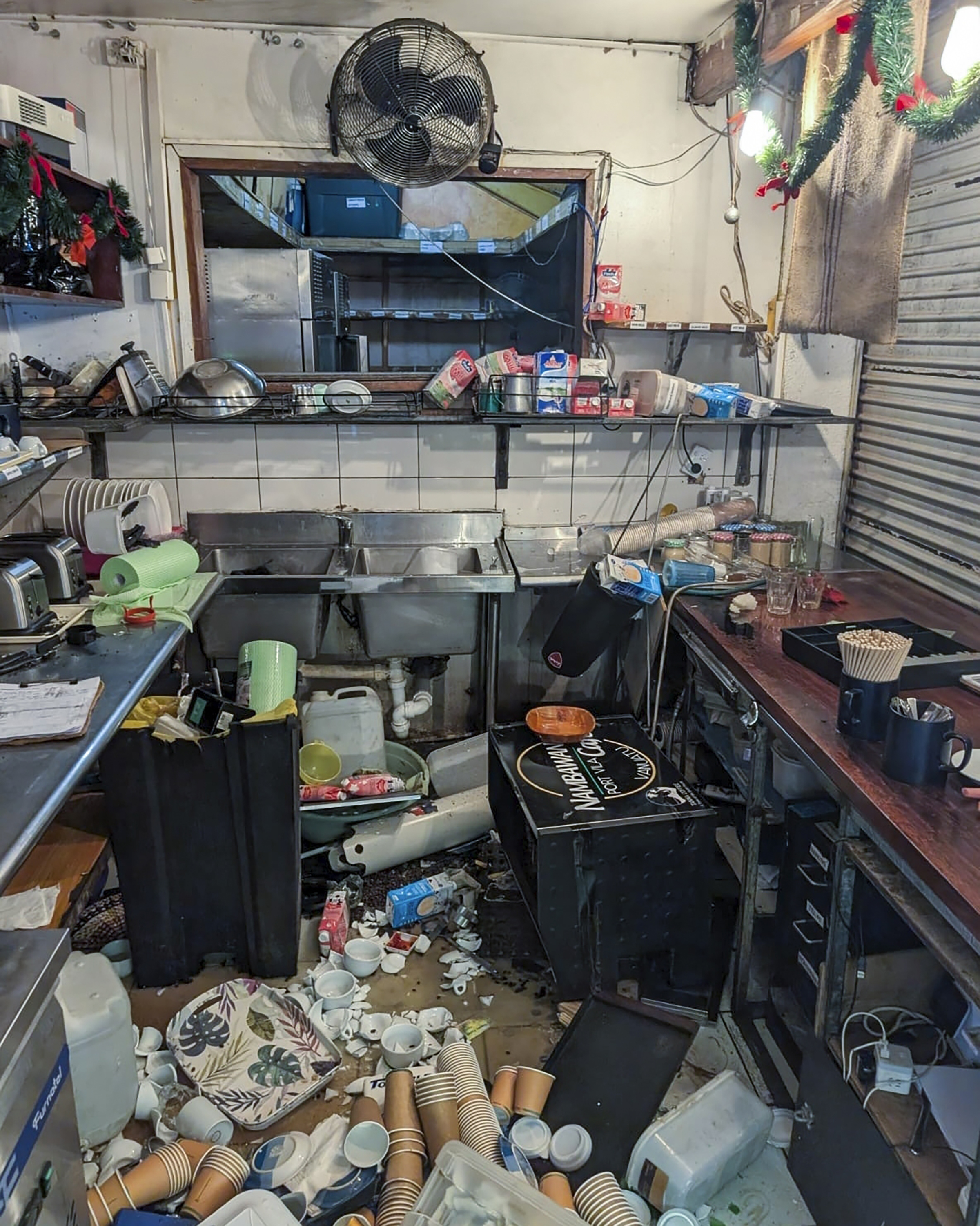 Damage to the inside of the Nambawan Cafe in Port Vila, Tuesday, Dec. 17, 2024, following a strong earthquake that struck just off the coast of Vanuatu in the South Pacific Ocean. (Ivan Oswald via AP)