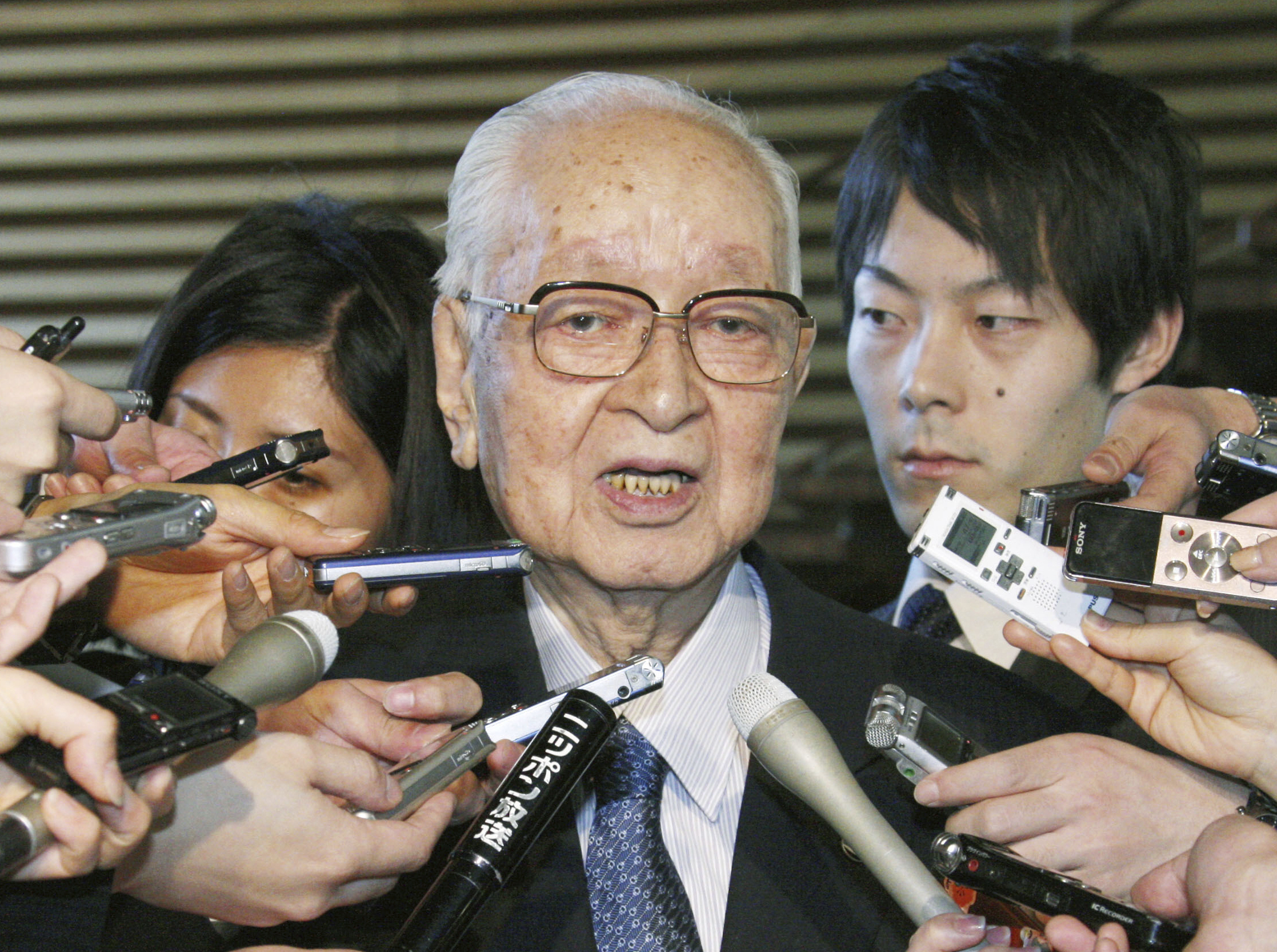 FILE - Japanese media mogul Tsuneo Watanabe, chairman of the Yomiuri Shimbun Holdings, speaks to reporters in Tokyo, on Jan. 17, 2014. (Kyodo News via AP, File)