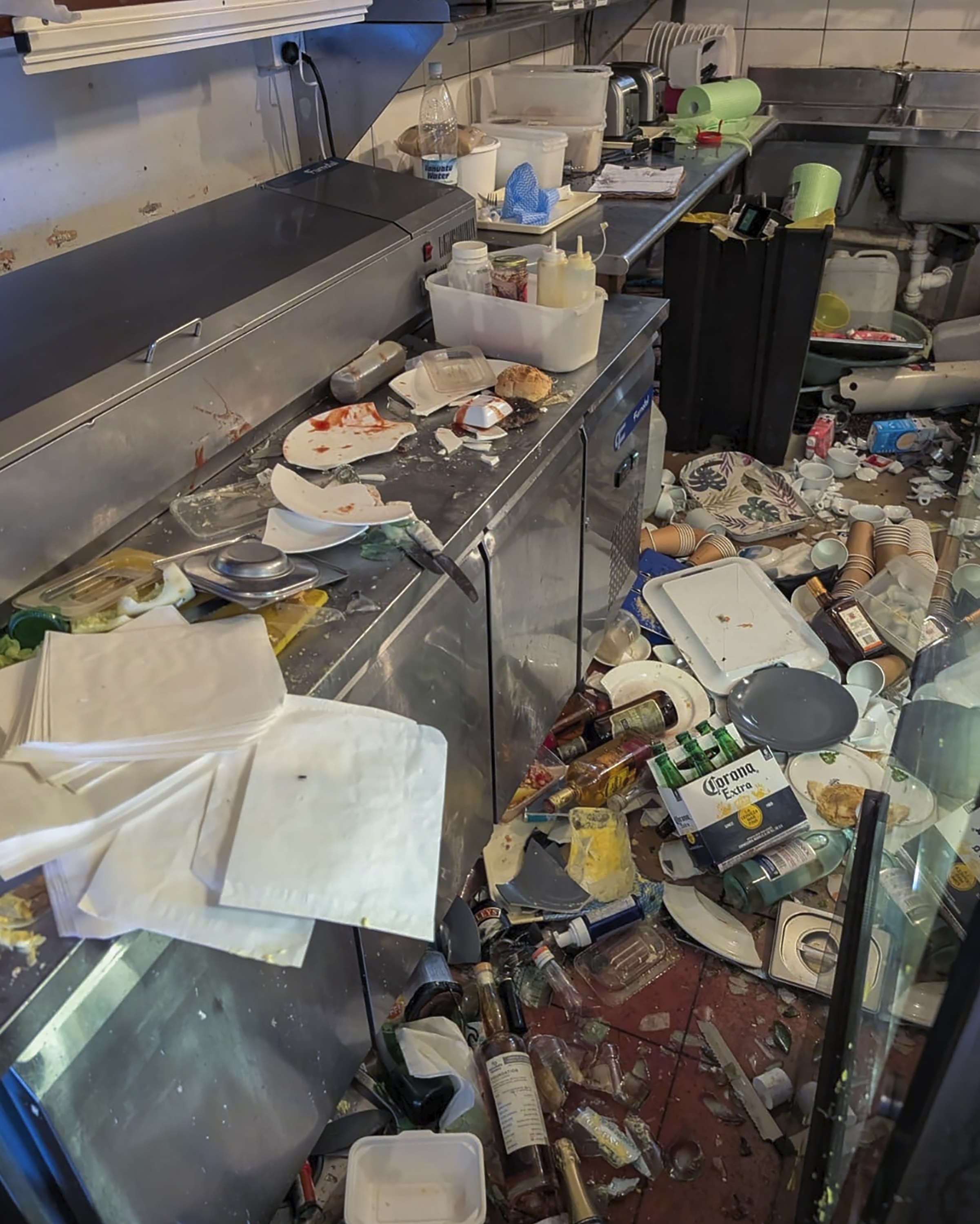 Damage to the inside of the Nambawan Cafe in Port Vila, Tuesday, Dec. 17, 2024, following a strong earthquake that struck just off the coast of Vanuatu in the South Pacific Ocean. (Ivan Oswald via AP)