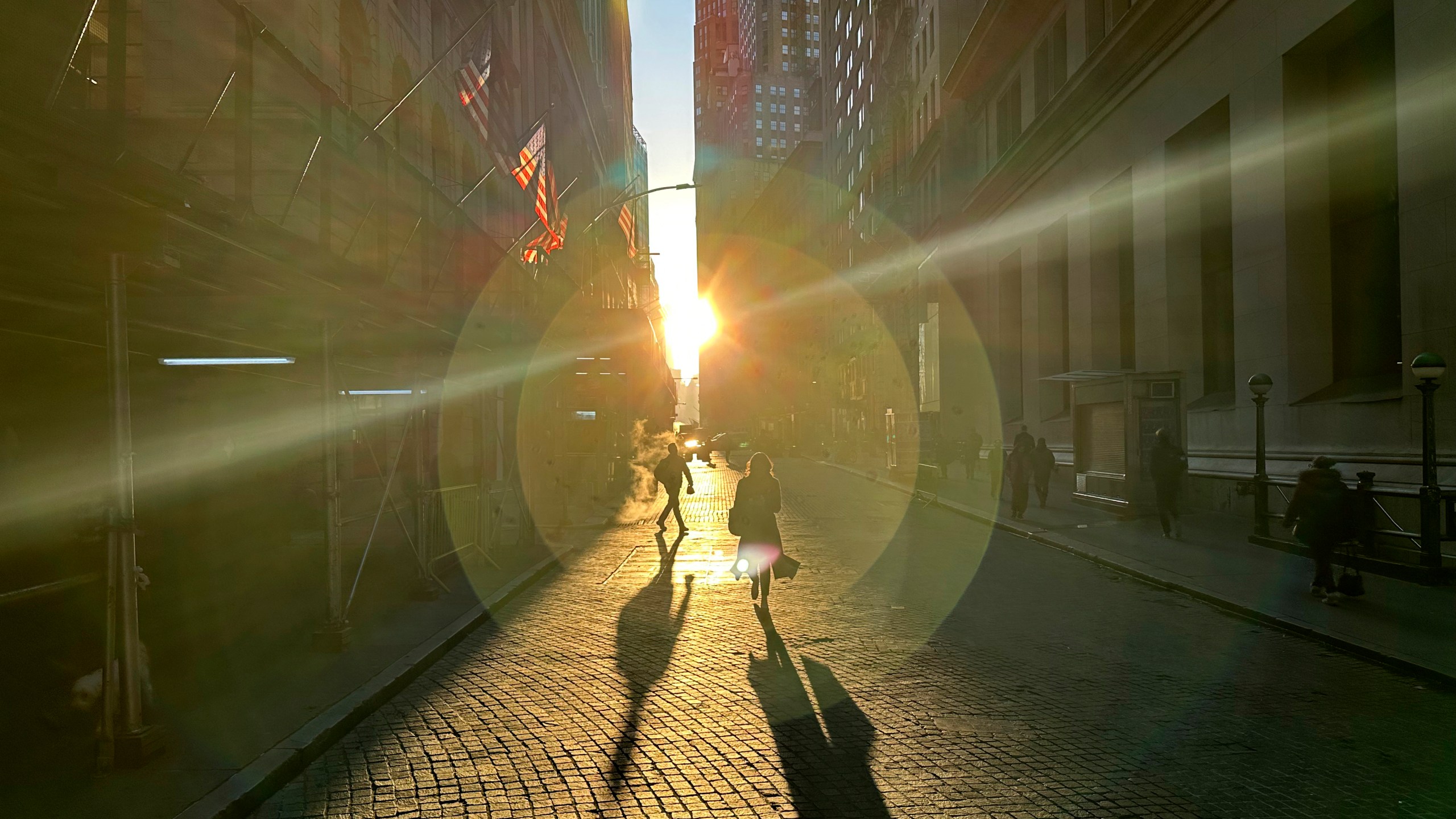 People walk on Wall Street in New York's Financial District on Wednesday, Dec. 18, 2024. (AP Photo/Peter Morgan, File)