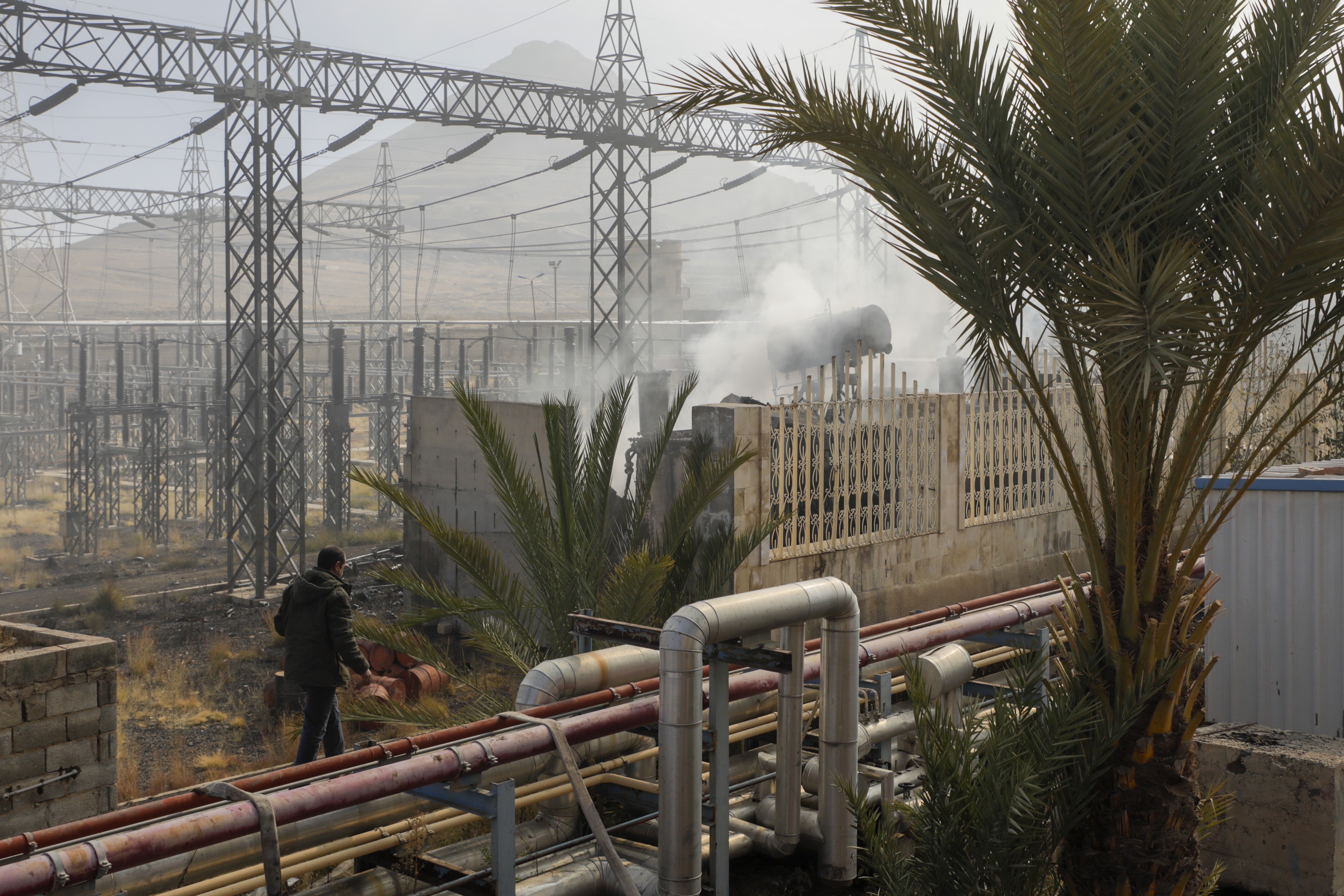 Smoke rises from the scene of an Israeli airstrike on the Haziz power station in southern Sanaa, Yemen, Thursday, Dec. 19, 2024. A series of intense Israeli airstrikes rocked Yemen's rebel-held capital and a port city early Thursday, killing at least nine people, according to officials. The strikes followed a Houthi missile attack on central Israel. (AP Photo/Osamah Abdulrahman)