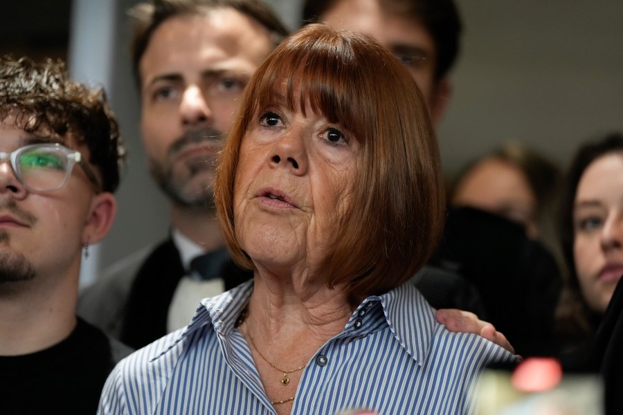 Gisele Pelicot speaks to the press as she leaves the courtroom, in the Avignon courthouse, southern France, Thursday, Dec. 19, 2024. (AP Photo/Lewis Joly)