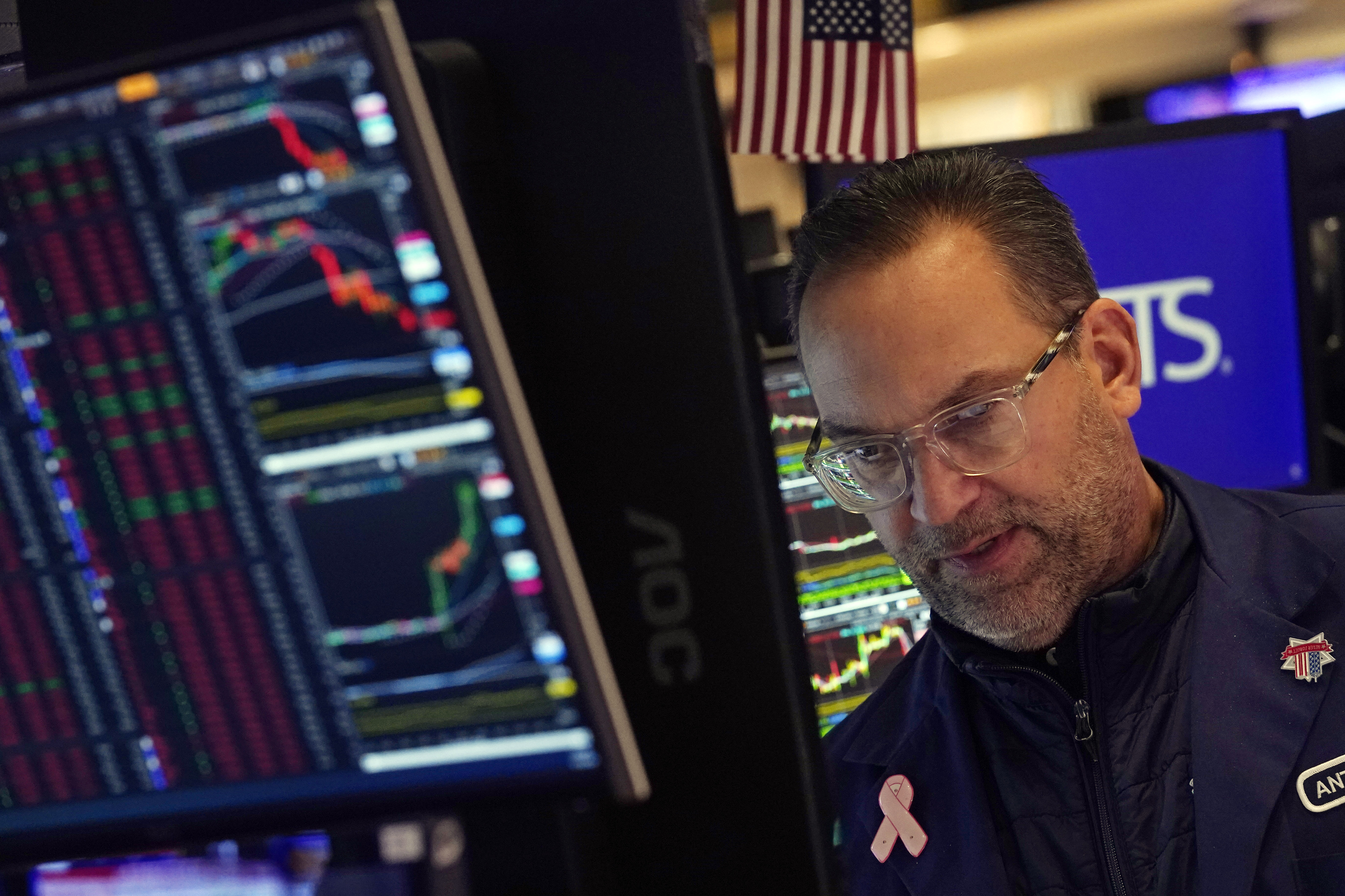 Specialist Anthony Matesic works on the floor of the New York Stock Exchange as the rate decision of the Federal Reserve is announced, Wednesday, Dec. 18, 2024. (AP Photo/Richard Drew)