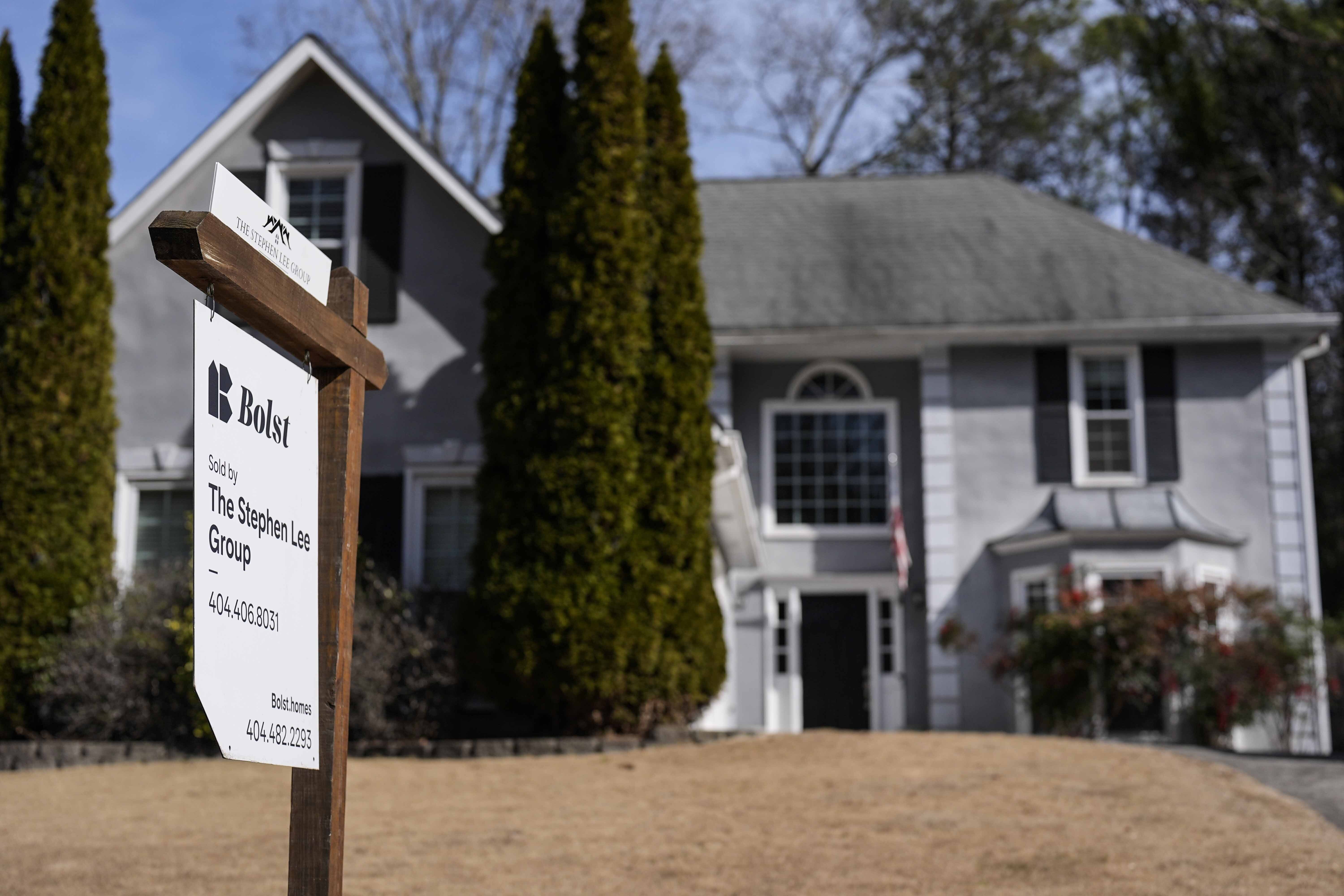 FILE - A sign announcing a home for sale is posted outside a home, Feb. 1, 2024, in Kennesaw, Ga. (AP Photo/Mike Stewart, File)