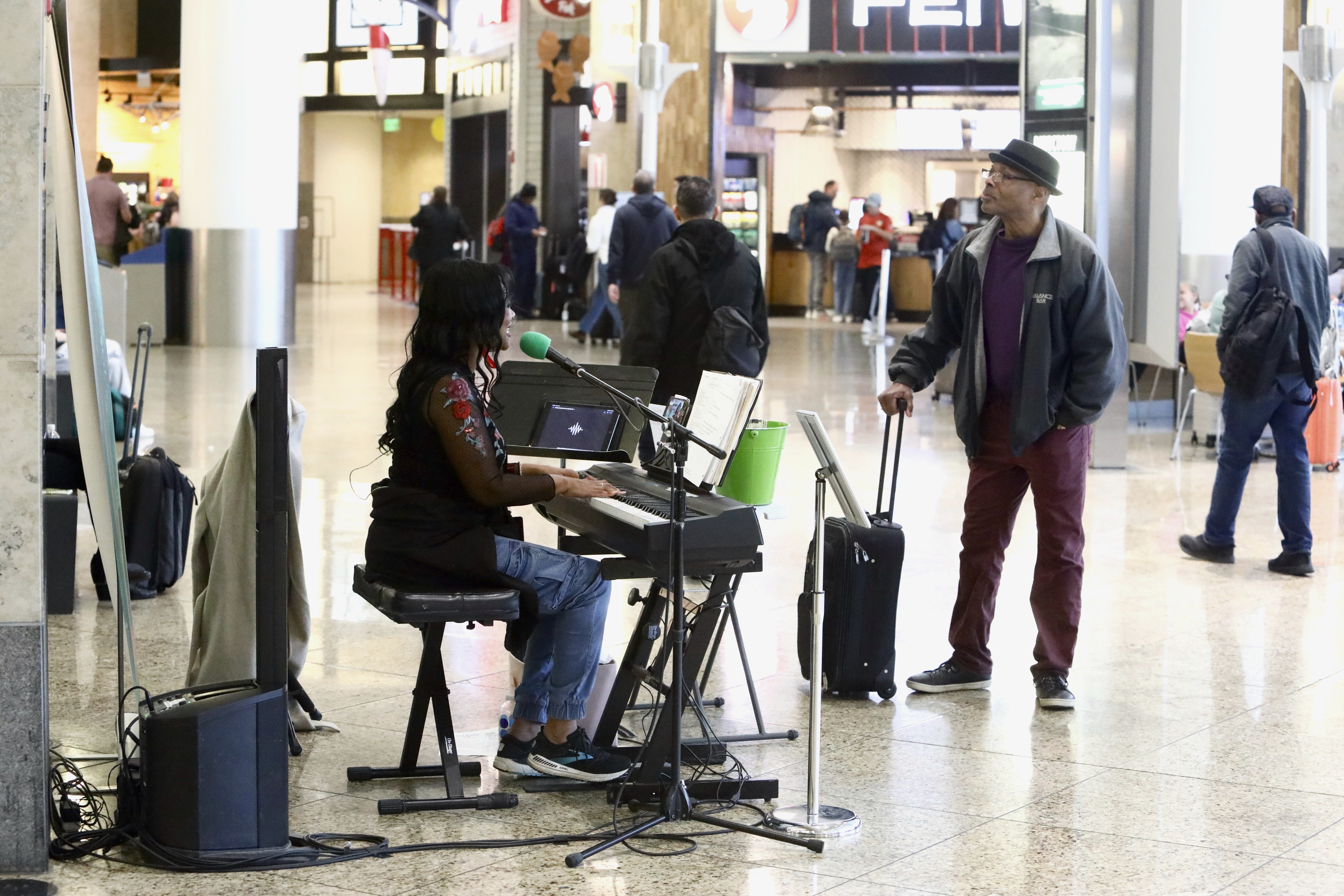 Roz McCommon performs at Seattle-Tacoma International Airport on November 26, 2024, in SeaTac, Wash. (AP Photo/Manuel Valdes)