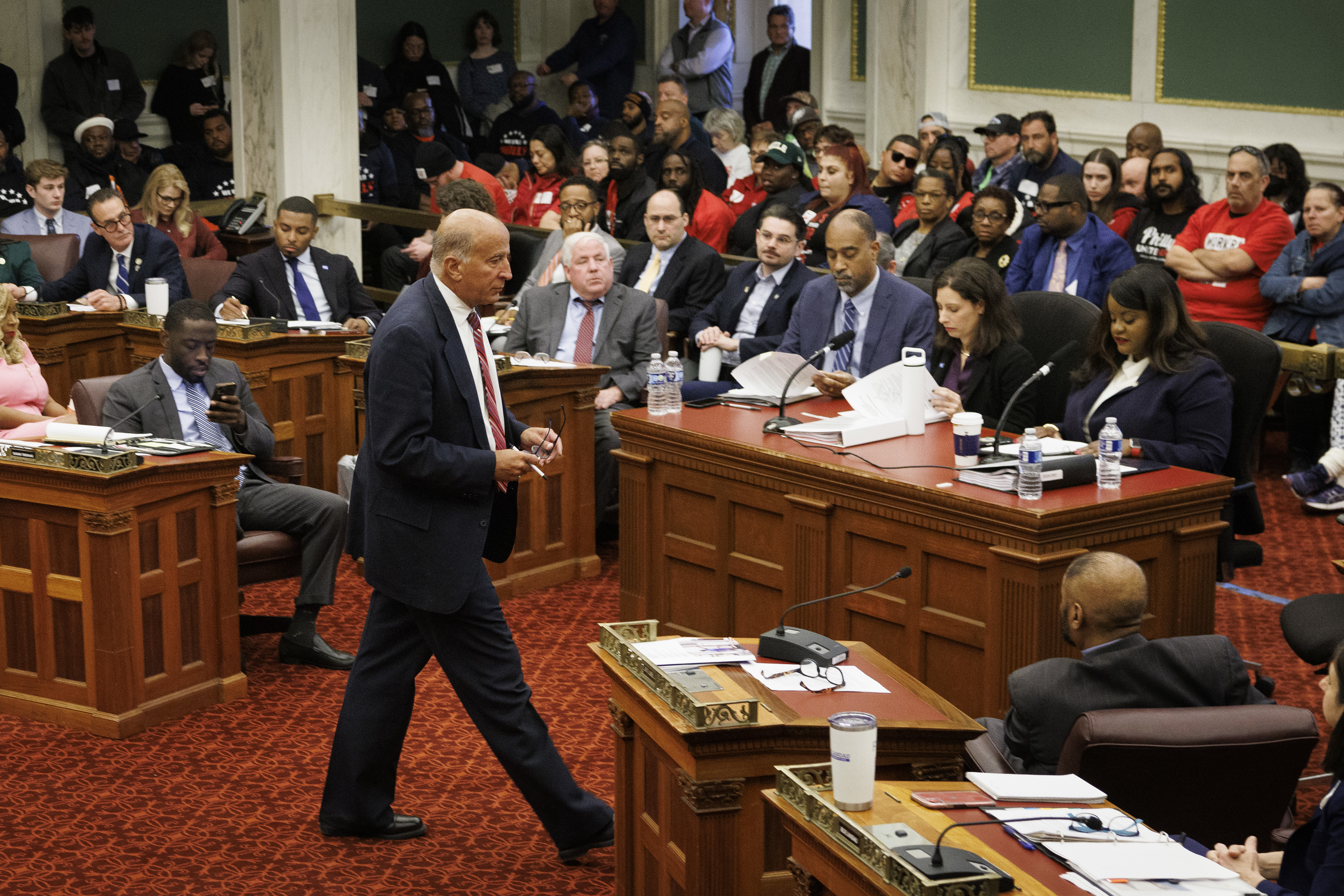 FILE - City Councilman Mark Squilla walks across the chambers at the start of a public hearing on the construction of a new arena for the NBA basketball team Philadelphia 76ers, Nov. 12, 2024, in Philadelphia. (Alejandro A. Alvarez/The Philadelphia Inquirer via AP, File)