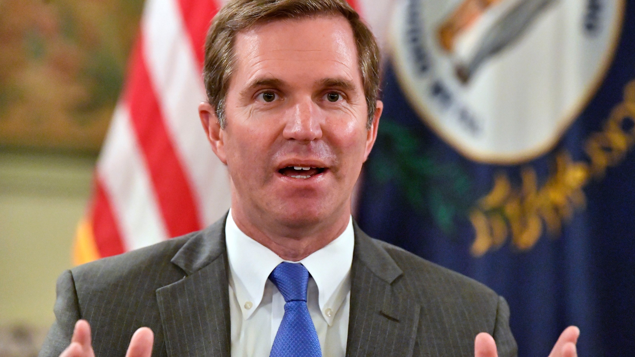 Kentucky Gov. Andy Beshear talks about the gains in the economic growth f the state during the past year in Frankfort, Ky., Wednesday, Dec. 18, 2024. (AP Photo/Timothy D. Easley)