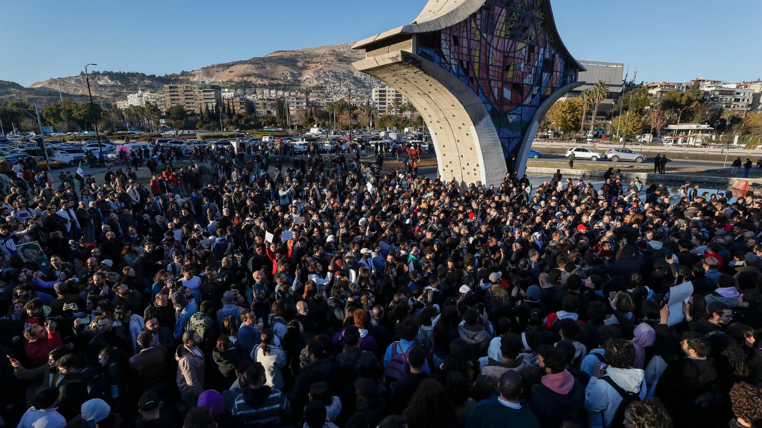 Syrian activists gather at the Umayyad square during a protest to demand a secular state, in Damascus, Syria, Thursday, Dec. 19, 2024. (AP Photo/Omar Sanadiki)