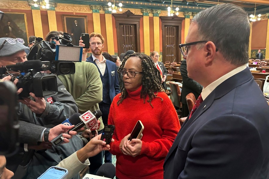 Michigan state Rep. Karen Whitsett, a Detroit Democrat, speaks to reporters in the Michigan House of Representatives in Lansing, Mich., Thursday, Dec. 19, 2024, alongside Republican minority leader Matt Hall. (AP Photo/Isabella Volmert)