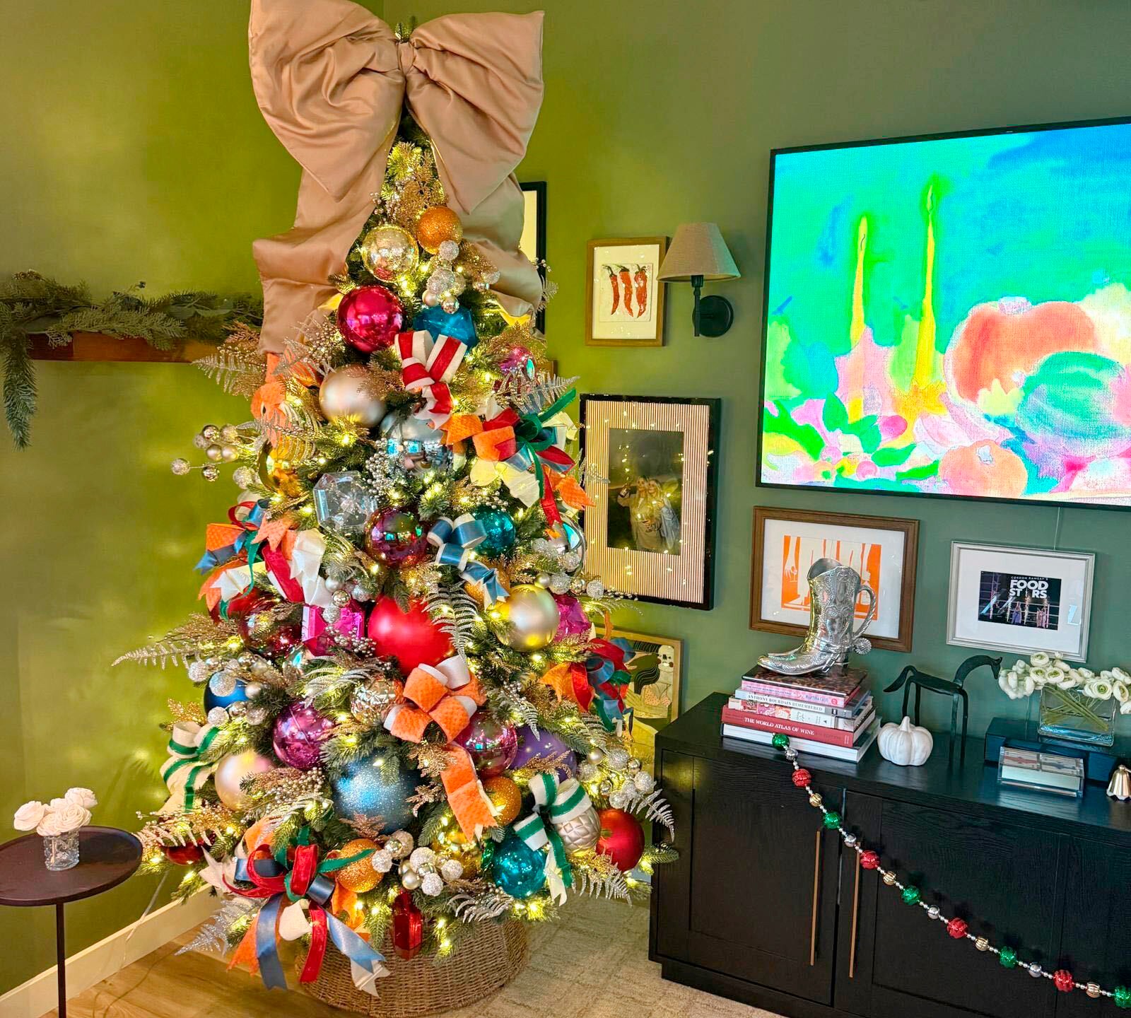 This undated photo provided by Jess Druey shows a skinny artificial tree bought at Target that Druey decorated with retro big holiday ornament balls in primary colors in reds and blues. (Jess Druey via AP)