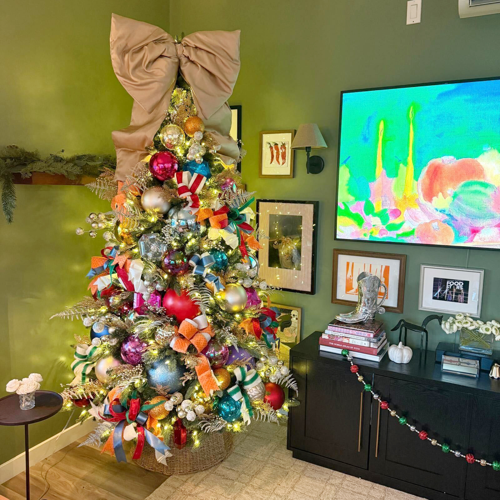 This undated photo provided by Jess Druey shows a skinny artificial tree bought at Target that Druey decorated with retro big holiday ornament balls in primary colors in reds and blues. (Jess Druey via AP)