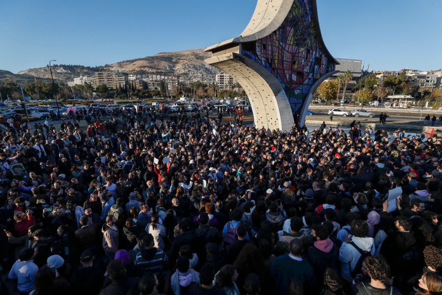 Syrian activists gather at the Umayyad square during a protest to demand a secular state, in Damascus, Syria, Thursday, Dec. 19, 2024. (AP Photo/Omar Sanadiki)