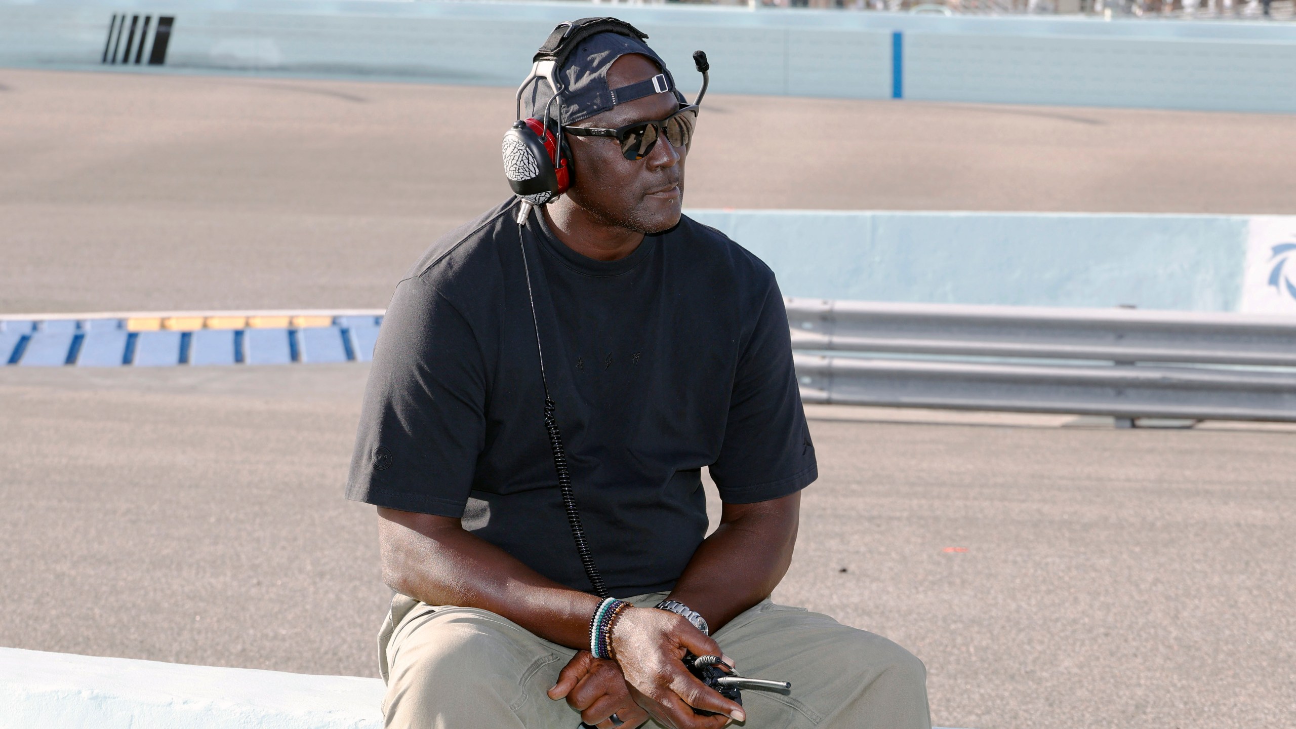 FILE - Car owner Michael Jordan watches from the pits during a NASCAR Cup Series auto race at Homestead-Miami Speedway in Homestead, Fla., Oct. 27, 2024. (AP Photo/Terry Renna, File)