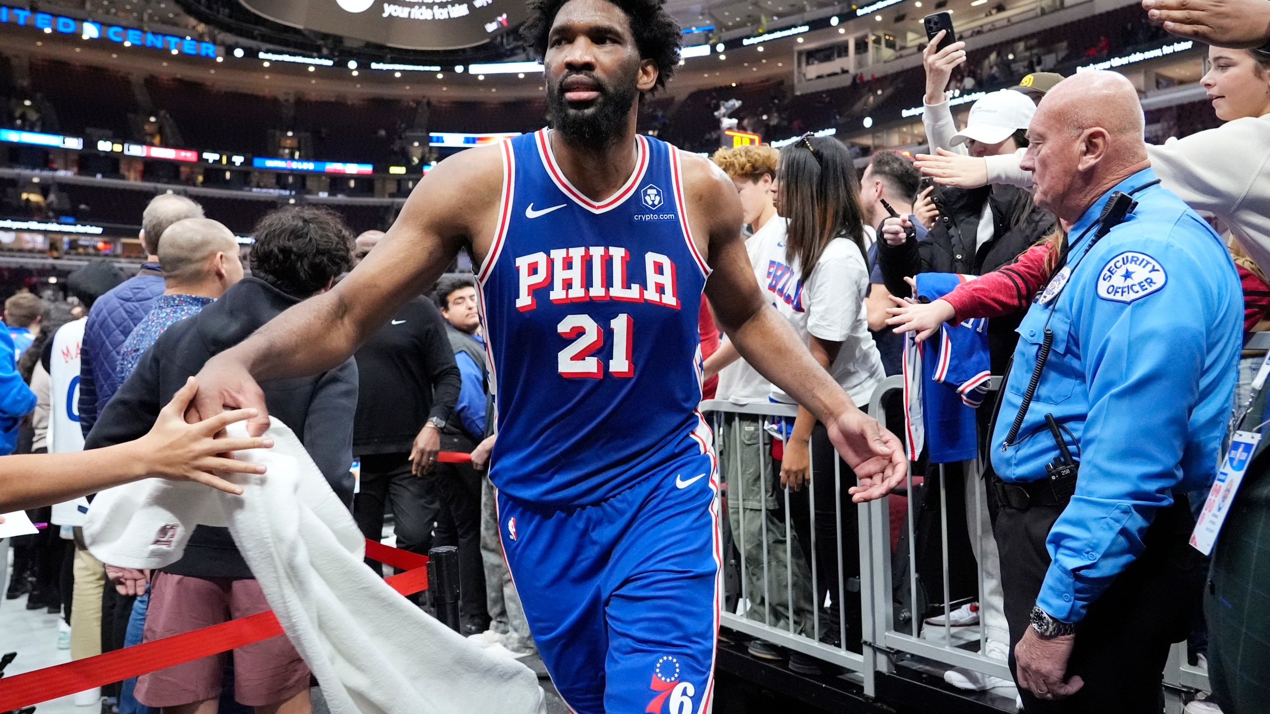 Philadelphia 76ers center Joel Embiid (21) celebrates with fans as he walks off the court after his team defeated the Chicago Bulls in an NBA basketball game in Chicago, Sunday, Dec. 8, 2024. (AP Photo/Nam Y. Huh)