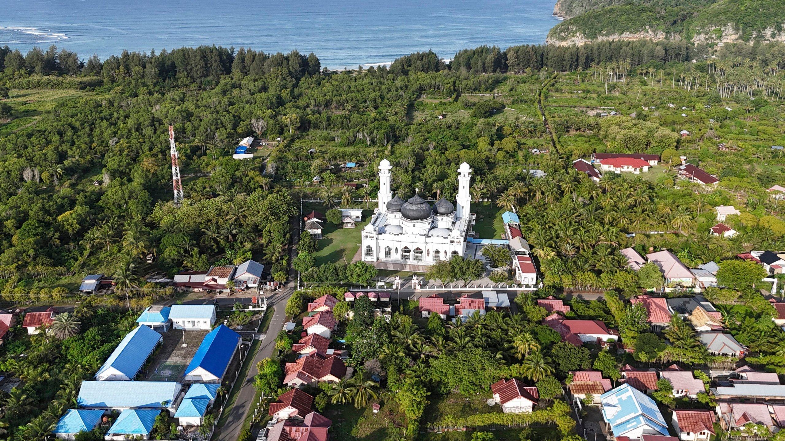 This aerial shot taken using a drone shows Rahmatullah Mosque in Lampuuk village, one of the areas hardest hit by Indian Ocean tsunami in 2004, in Aceh Besar, Indonesia, Thursday, Dec. 12, 2024. (AP Photo/Achmad Ibrahim)