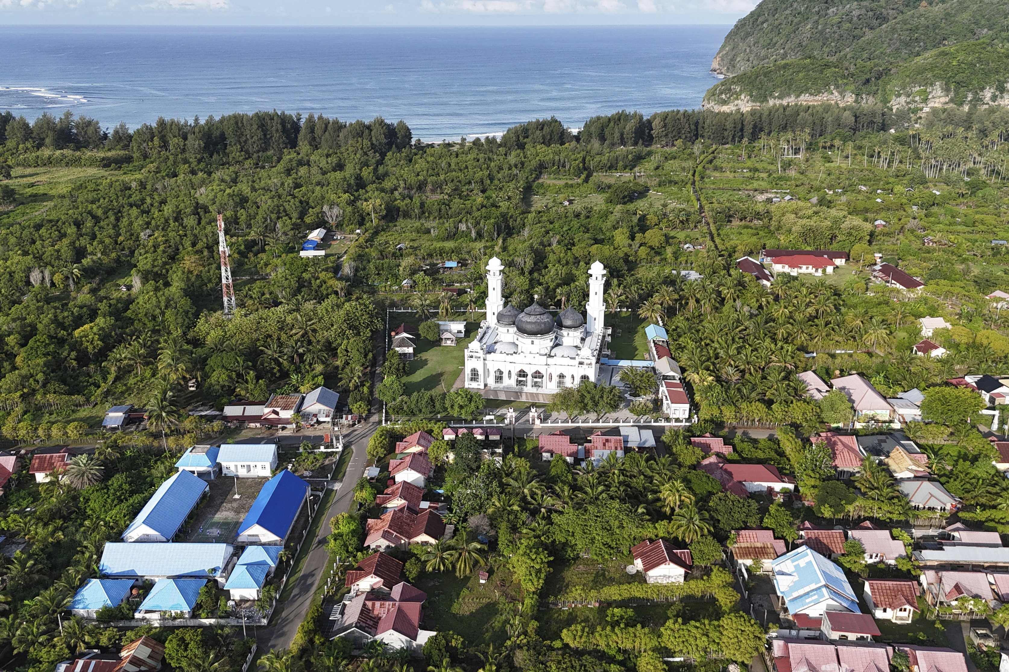 This aerial shot taken using a drone shows Rahmatullah Mosque in Lampuuk village, one of the areas hardest hit by Indian Ocean tsunami in 2004, in Aceh Besar, Indonesia, Thursday, Dec. 12, 2024. (AP Photo/Achmad Ibrahim)