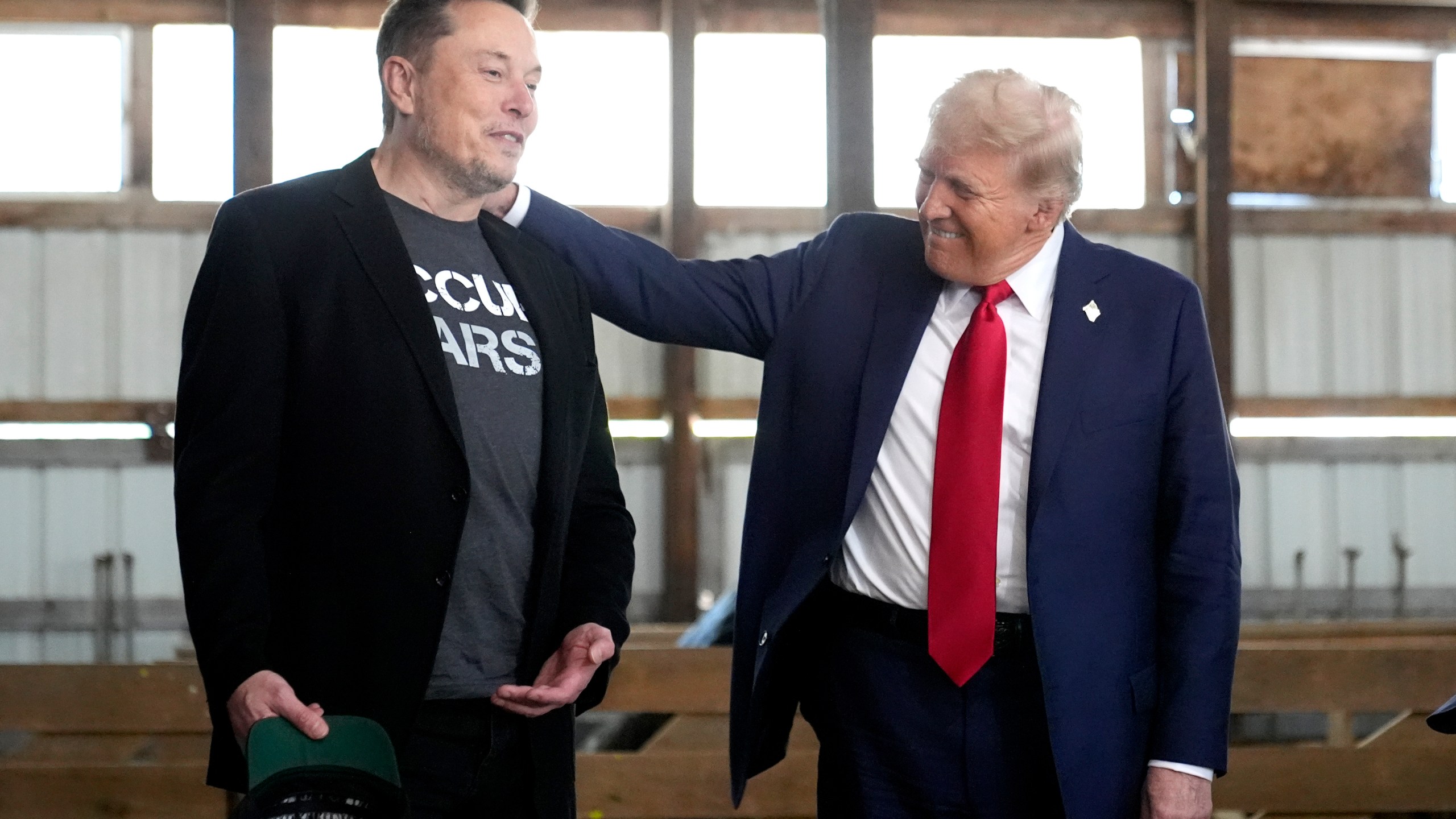 FILE - Tesla and SpaceX CEO Elon Musk, left, and Republican presidential nominee former President Donald Trump attend a campaign event at the Butler Farm Show, Oct. 5, 2024, in Butler, Pa. (AP Photo/Alex Brandon, File)