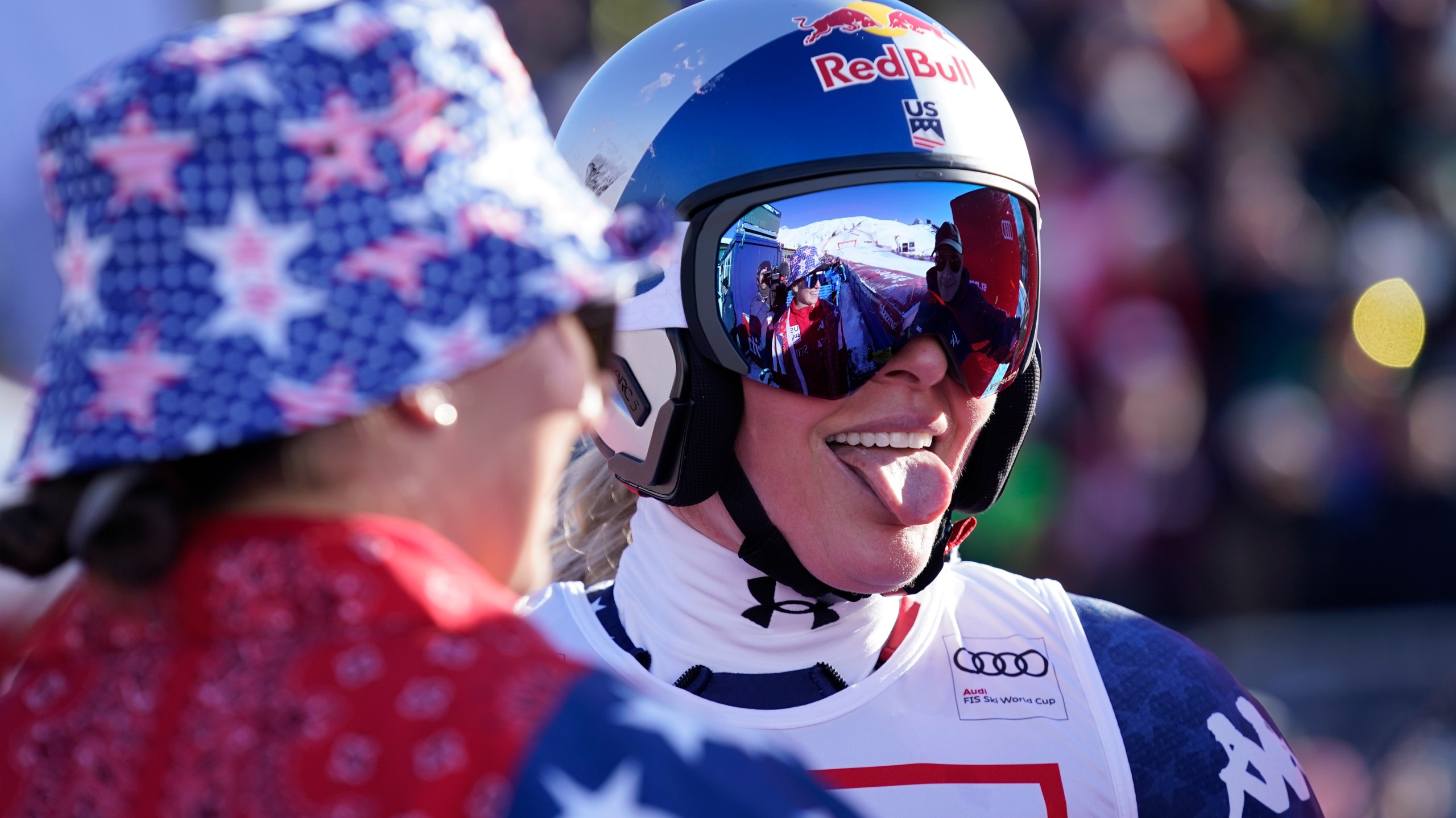 United States' Lindsey Vonn celebrates at the finish area of an alpine ski, women's World Cup super G, in St. Moritz, Switzerland, Saturday, Dec. 21, 2024. (AP Photo/Giovanni Auletta)