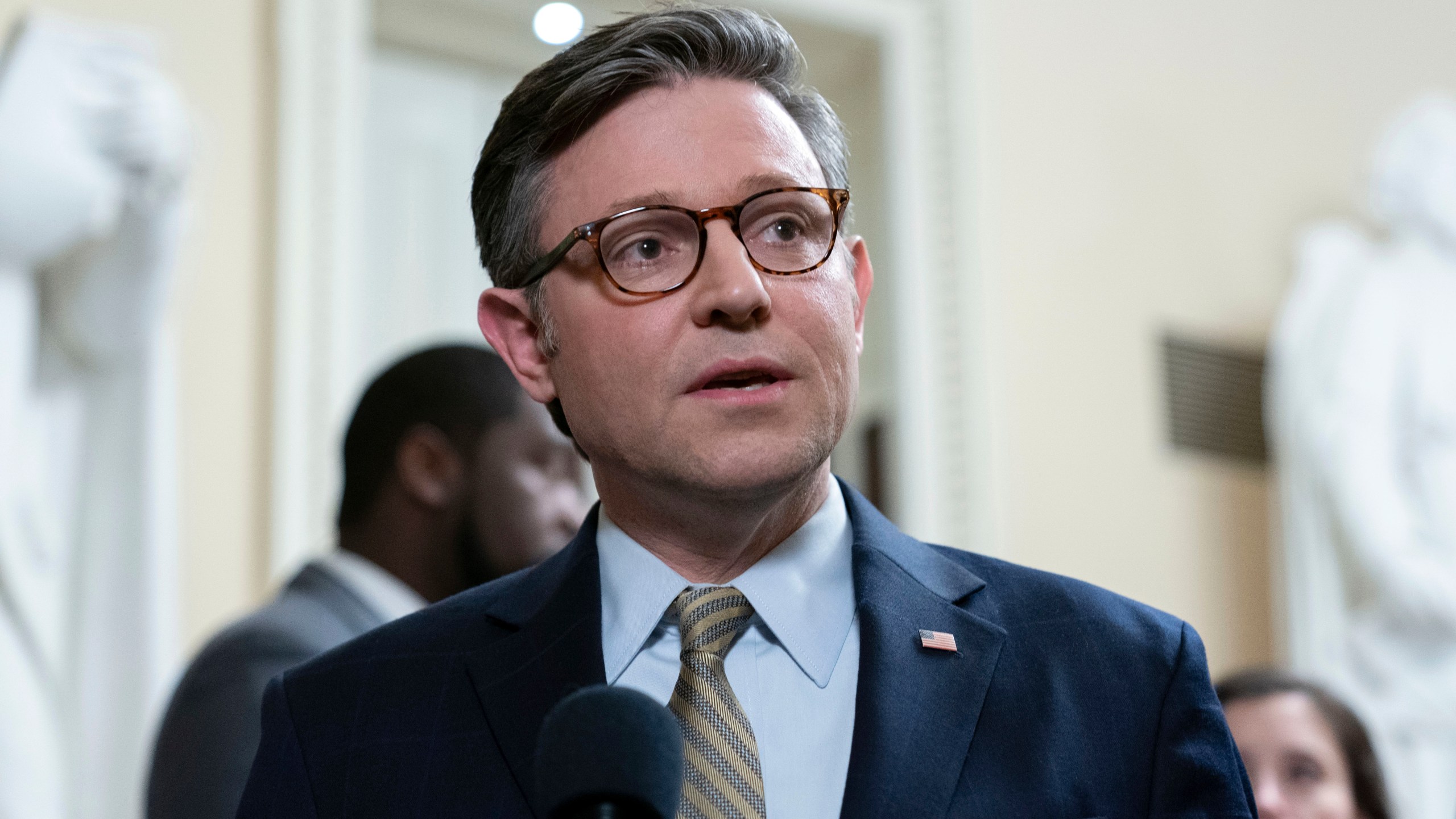 Speaker of the House Mike Johnson, R-La., talks to reporters after passing the funding bill to avert the government shutdown at the Capitol in Washington, Friday, Dec. 20, 2024. (AP Photo/Jose Luis Magana)