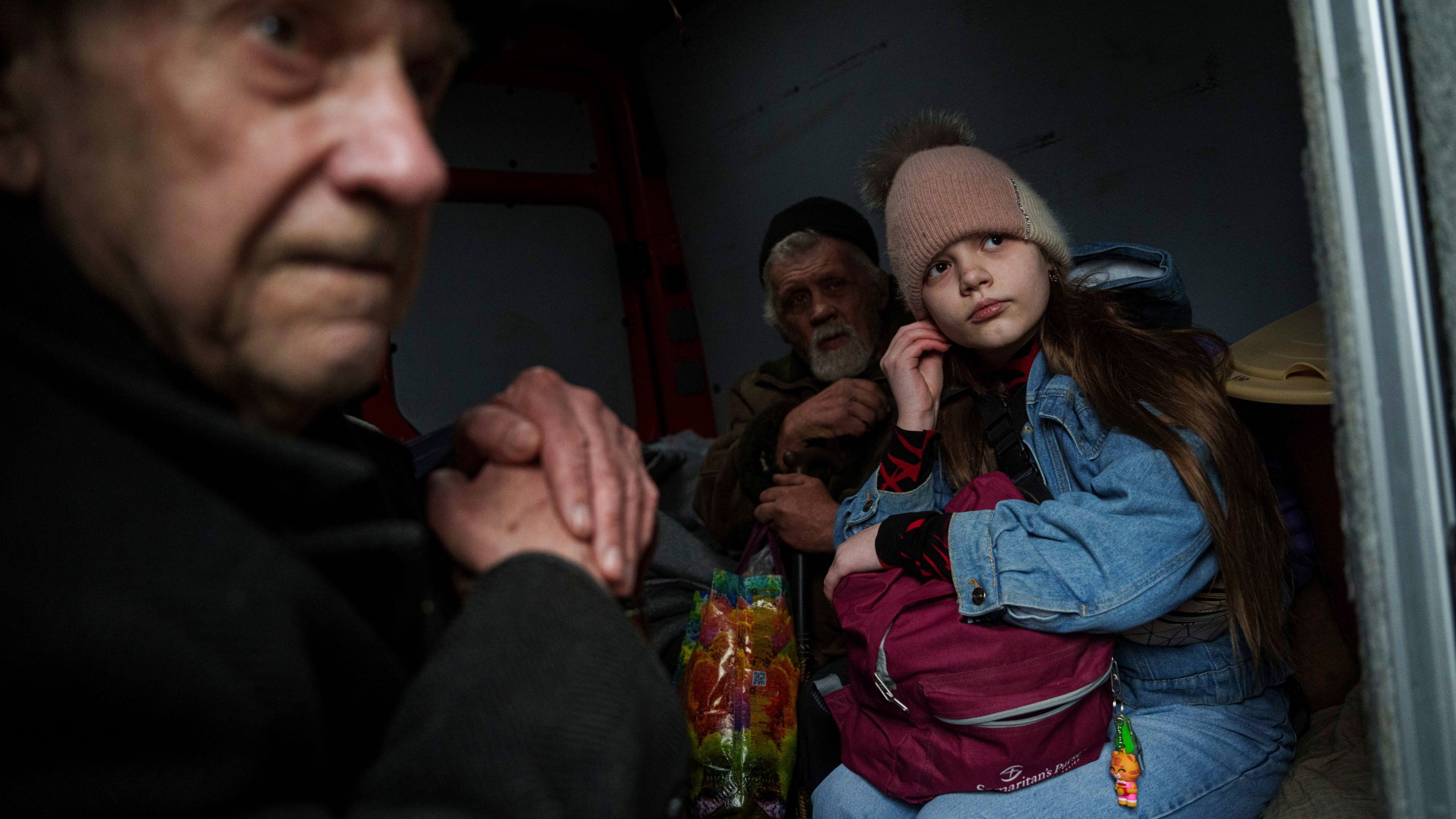 Hanna, 12, and her family sit ride inside a van during an evacuation from Pokrovsk, Ukraine, Saturday, Dec. 21, 2024. (AP Photo/Evgeniy Maloletka)