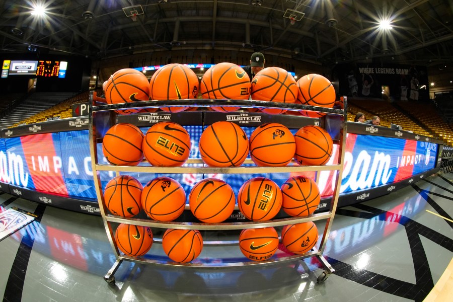 FILE - In this image taken with a fisheye lens , basketballs sit in a rack for players to warm up before an NCAA college basketball game between Colorado and Washington State, Saturday, March 2, 2024, in Boulder, Colo. (AP Photo/David Zalubowski, File)