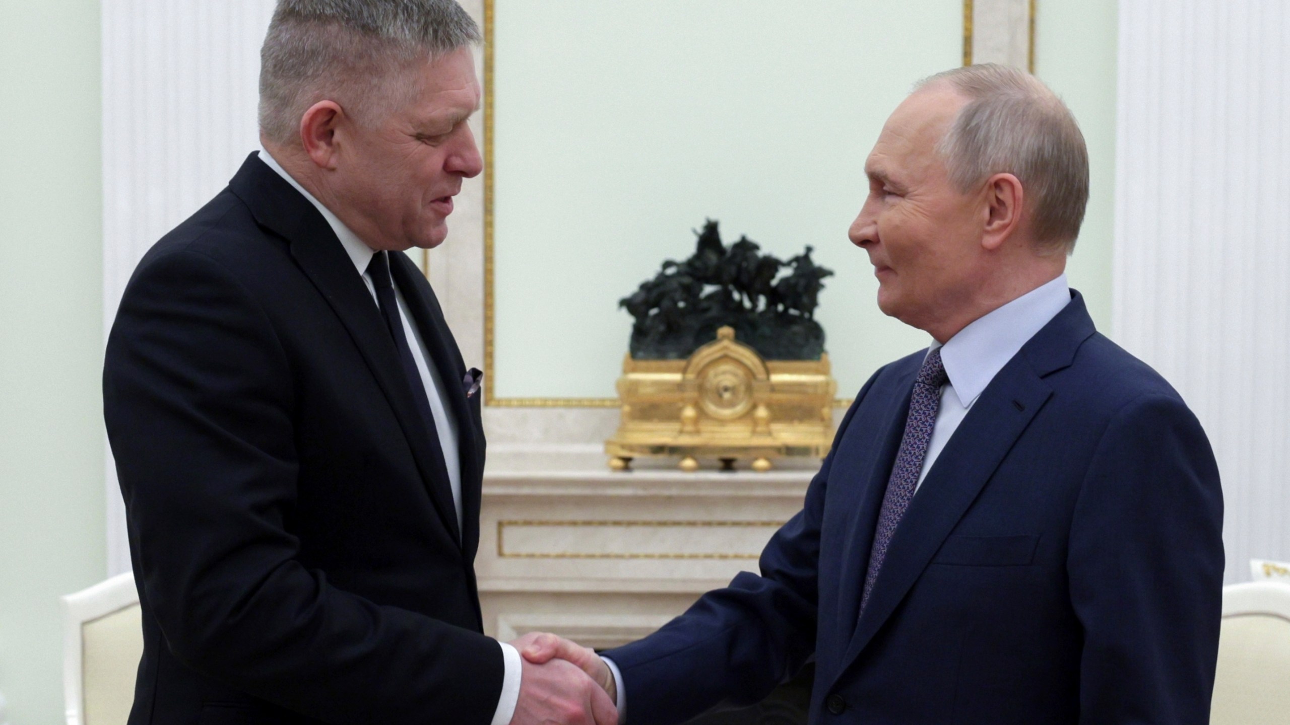 Russian President Vladimir Putin, right, and Slovak Prime Minister Robert Fico shake hands during their meeting at the Kremlin in Moscow, Russia, Sunday, Dec. 22, 2024. (Gavriil Grigorov, Sputnik, Kremlin Pool Photo via AP)