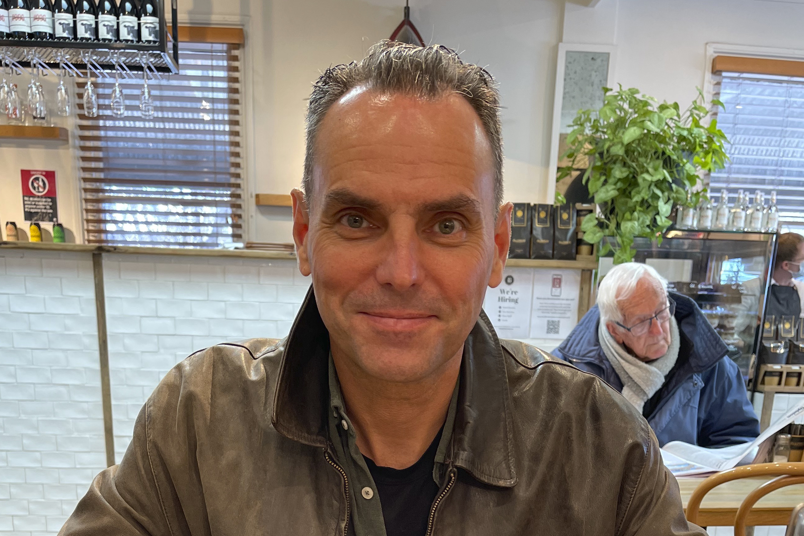 FILE - In this undated photo provided by Saffrine Duggan, her husband, former U.S. Marine Corps pilot Daniel Duggan, poses for a photo in a restaurant. (Saffrine Duggan via AP, File)