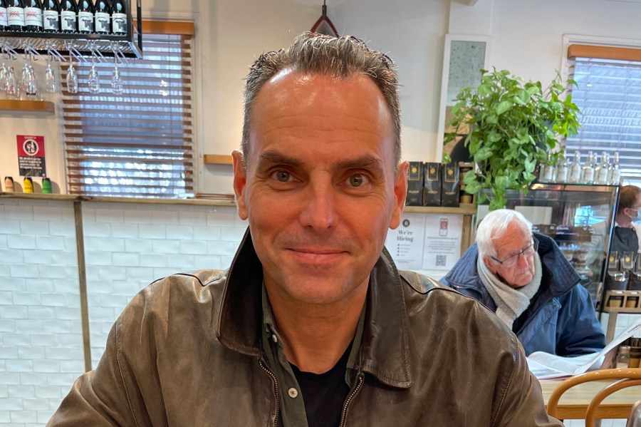 FILE - In this undated photo provided by Saffrine Duggan, her husband, former U.S. Marine Corps pilot Daniel Duggan, poses for a photo in a restaurant. (Saffrine Duggan via AP, File)