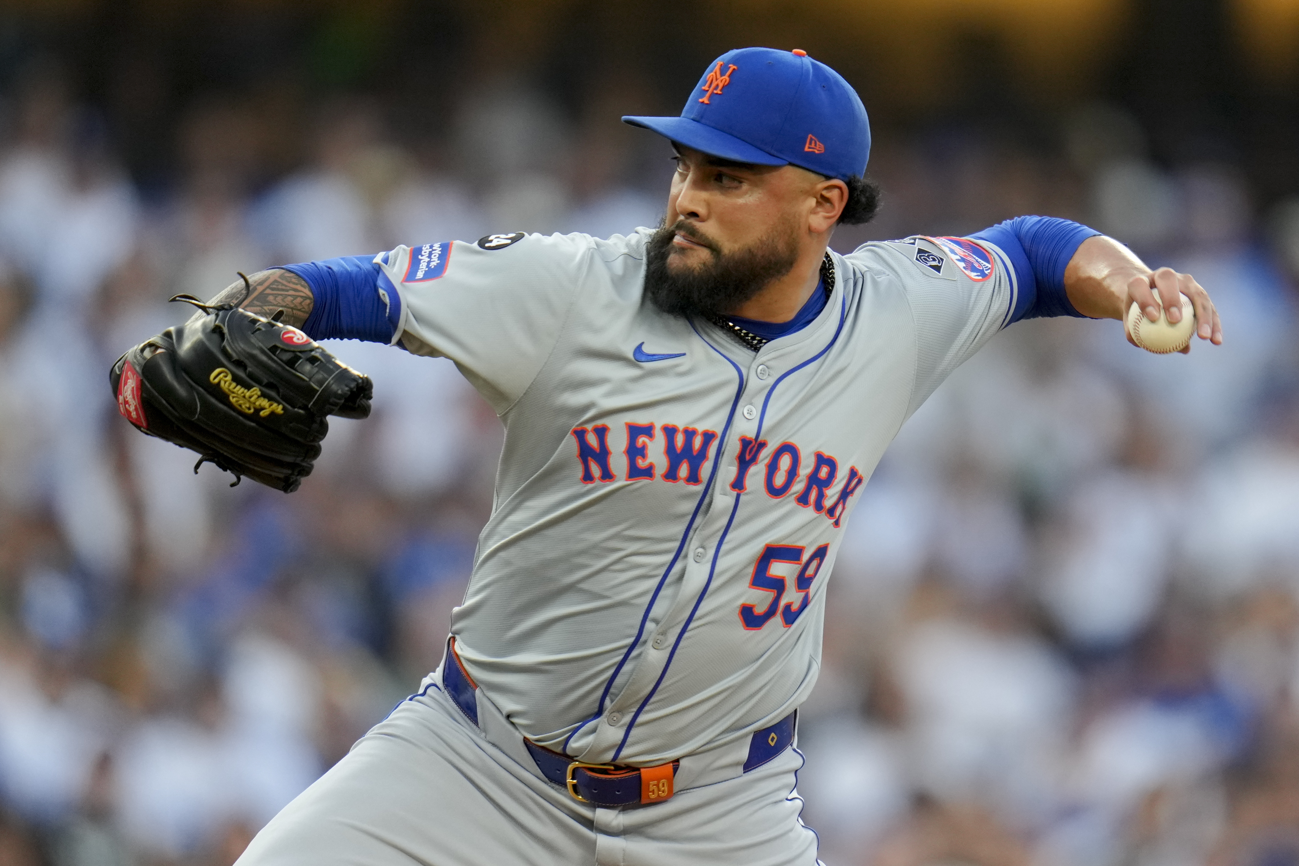 FILE - New York Mets pitcher Sean Manaea throws against the Los Angeles Dodgers during the first inning in Game 6 of a baseball NL Championship Series, Sunday, Oct. 20, 2024, in Los Angeles. (AP Photo/Julio Cortez, File)