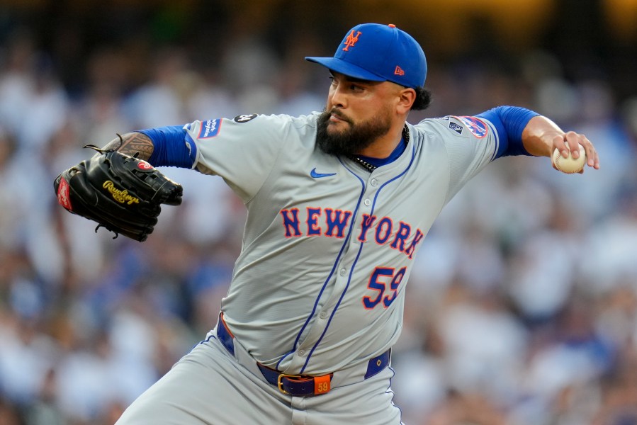 FILE - New York Mets pitcher Sean Manaea throws against the Los Angeles Dodgers during the first inning in Game 6 of a baseball NL Championship Series, Sunday, Oct. 20, 2024, in Los Angeles. (AP Photo/Julio Cortez, File)