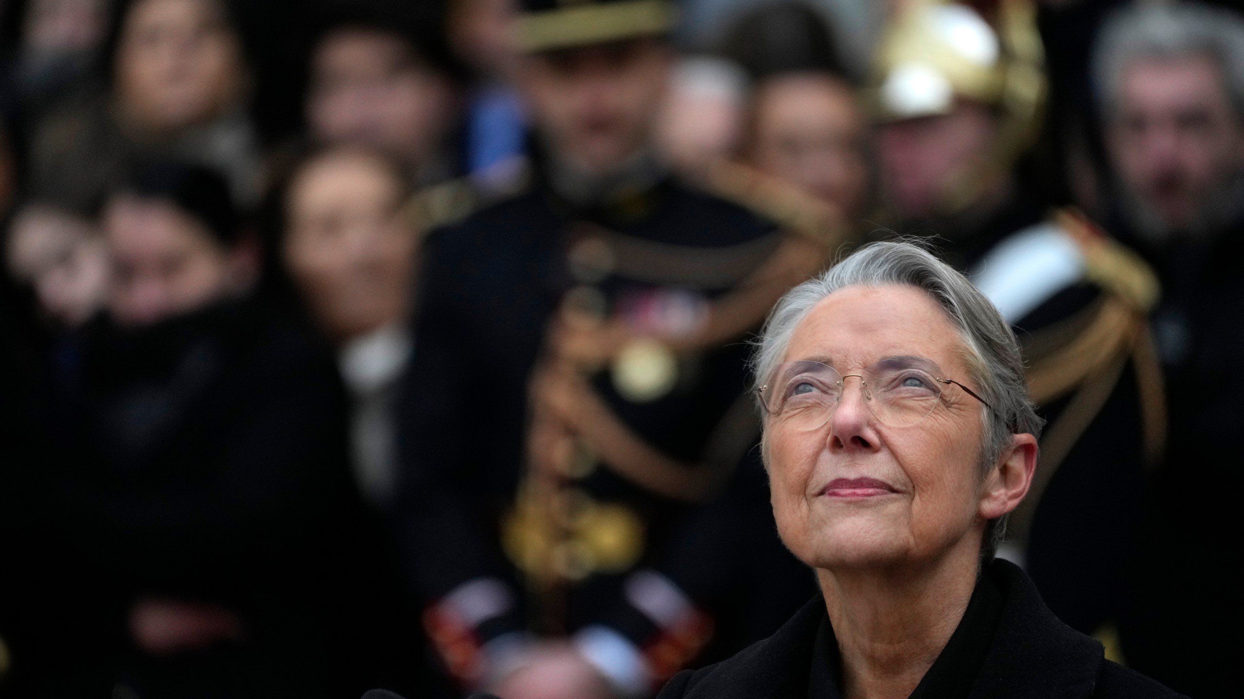 FILE - Outgoing French Prime Minister Elisabeth Borne looks up after the handover ceremony, Tuesday, Jan. 9, 2024 in Paris. (AP Photo/Thibault Camus, File)